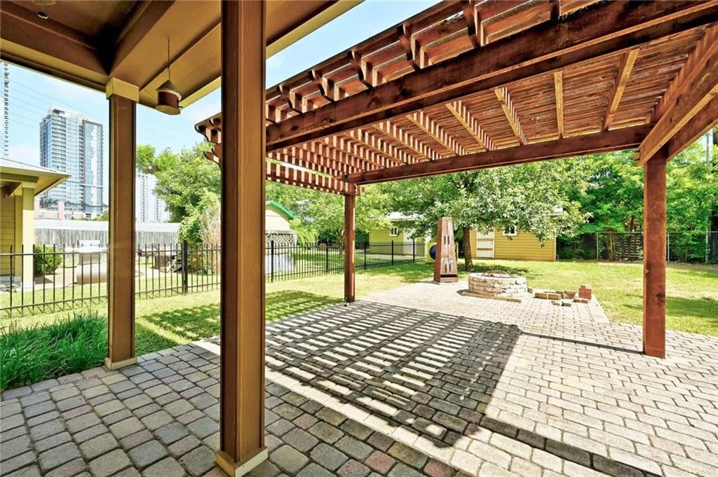 a view of a porch with wooden floor and fence