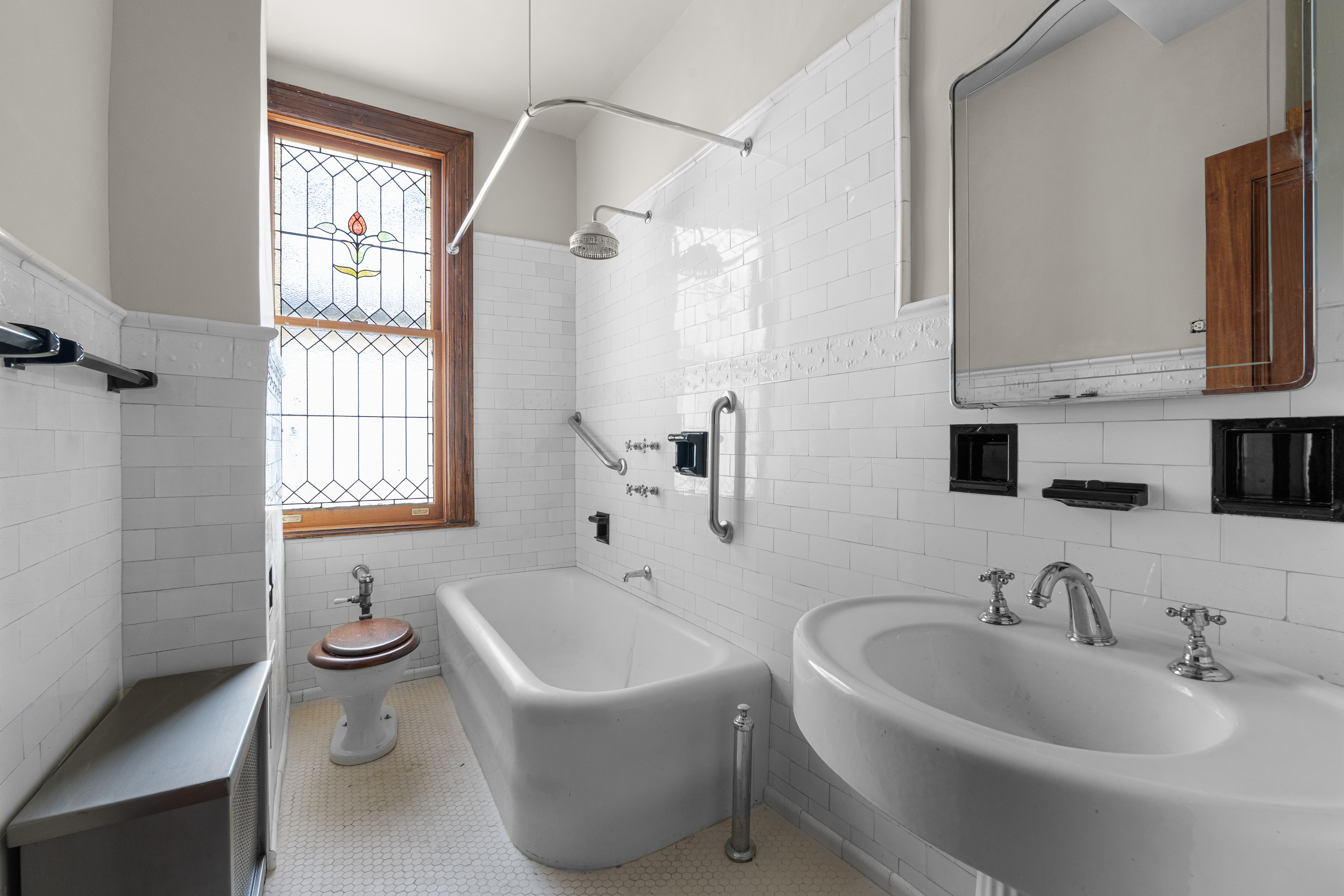 645 West End Avenue, Unit 11D Manhattan, NY 10025 - Photo 11 of 21 a bathroom with a bathtub a sink a window and a shower