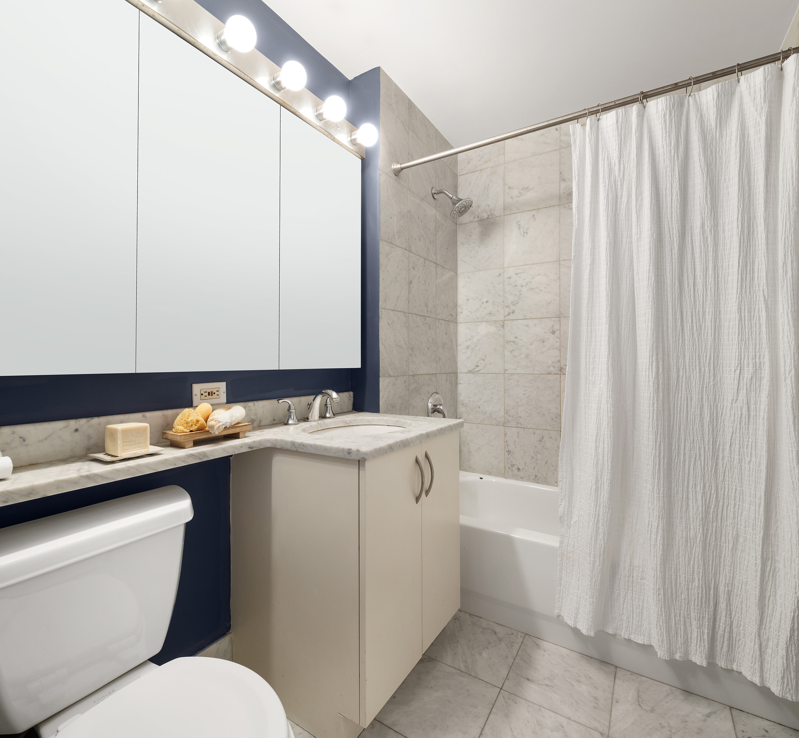 199 Bowery, Unit 3D Manhattan, NY 10002 - Photo 9 of 12 a bathroom with a sink toilet and shower