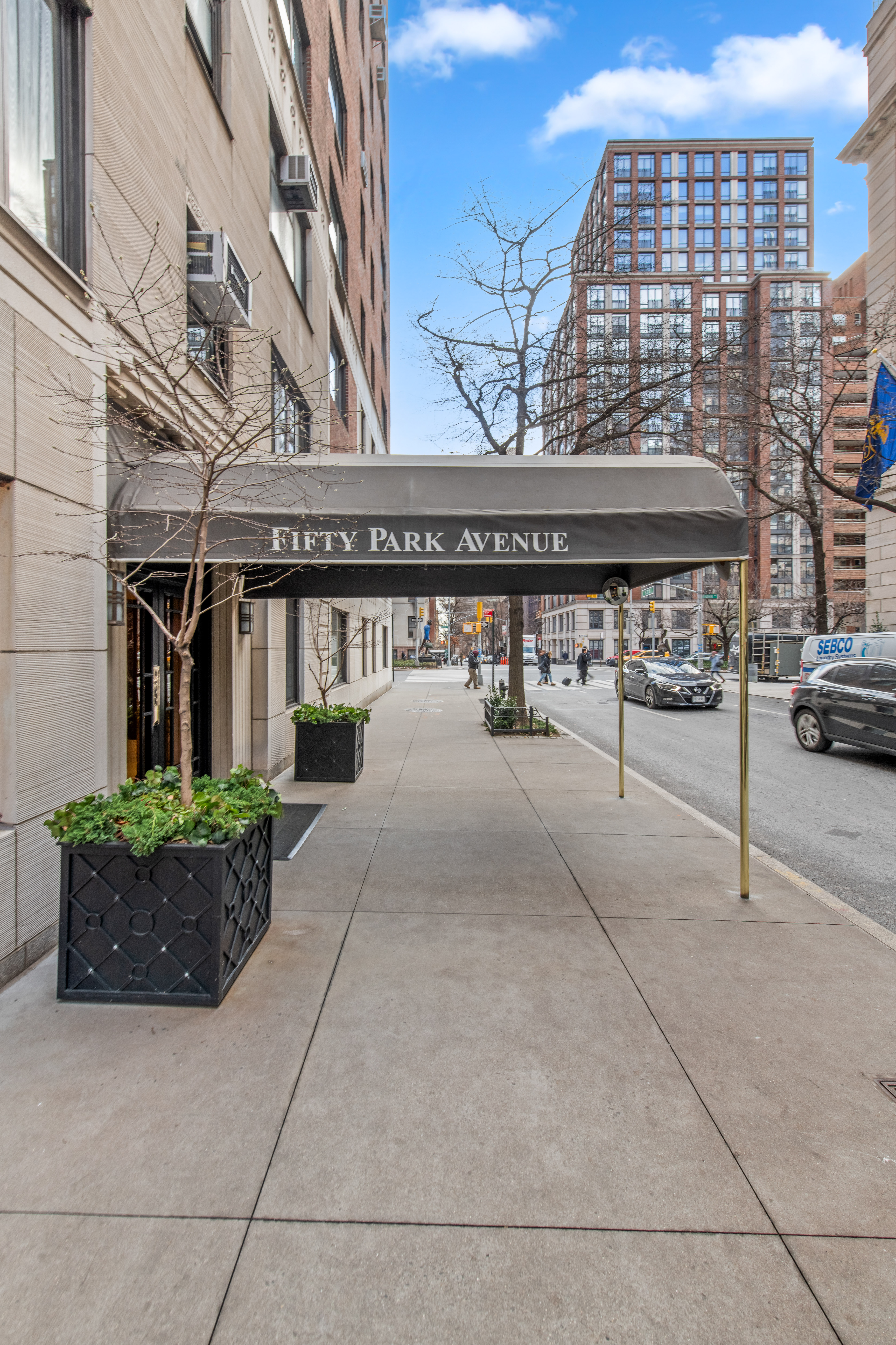 50 Park Avenue, Unit 4C Manhattan, NY 10016 - Photo 9 of 10 front view of a building with a street
