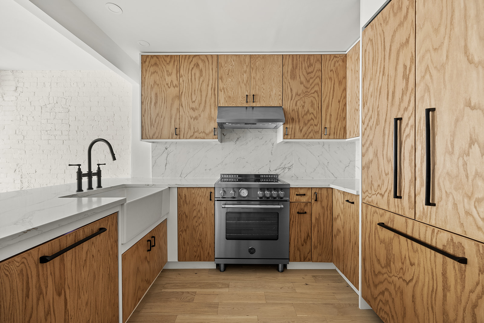 84 6th Avenue, Unit 1 Brooklyn, NY 11217 - Photo 4 of 14 a kitchen with stainless steel appliances granite countertop a stove and a sink