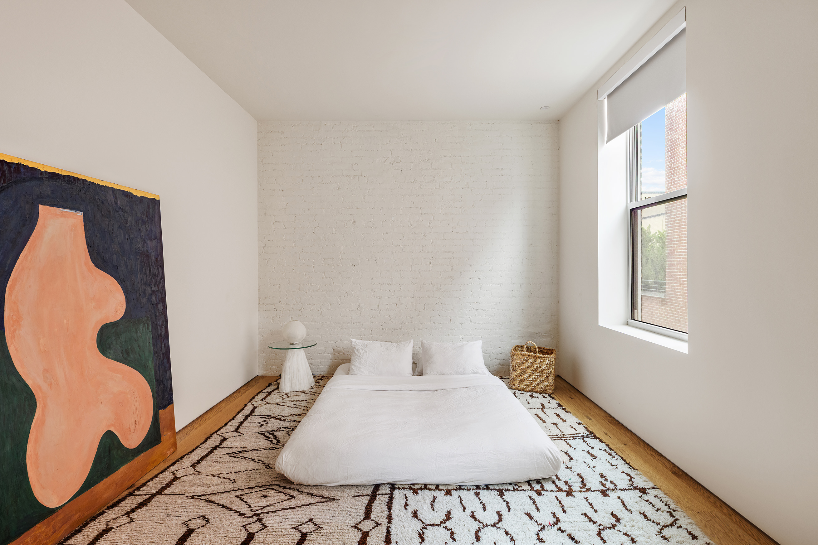 477 Broome Street Manhattan, NY 10013 - Photo 11 of 18 a bedroom with a bed and window