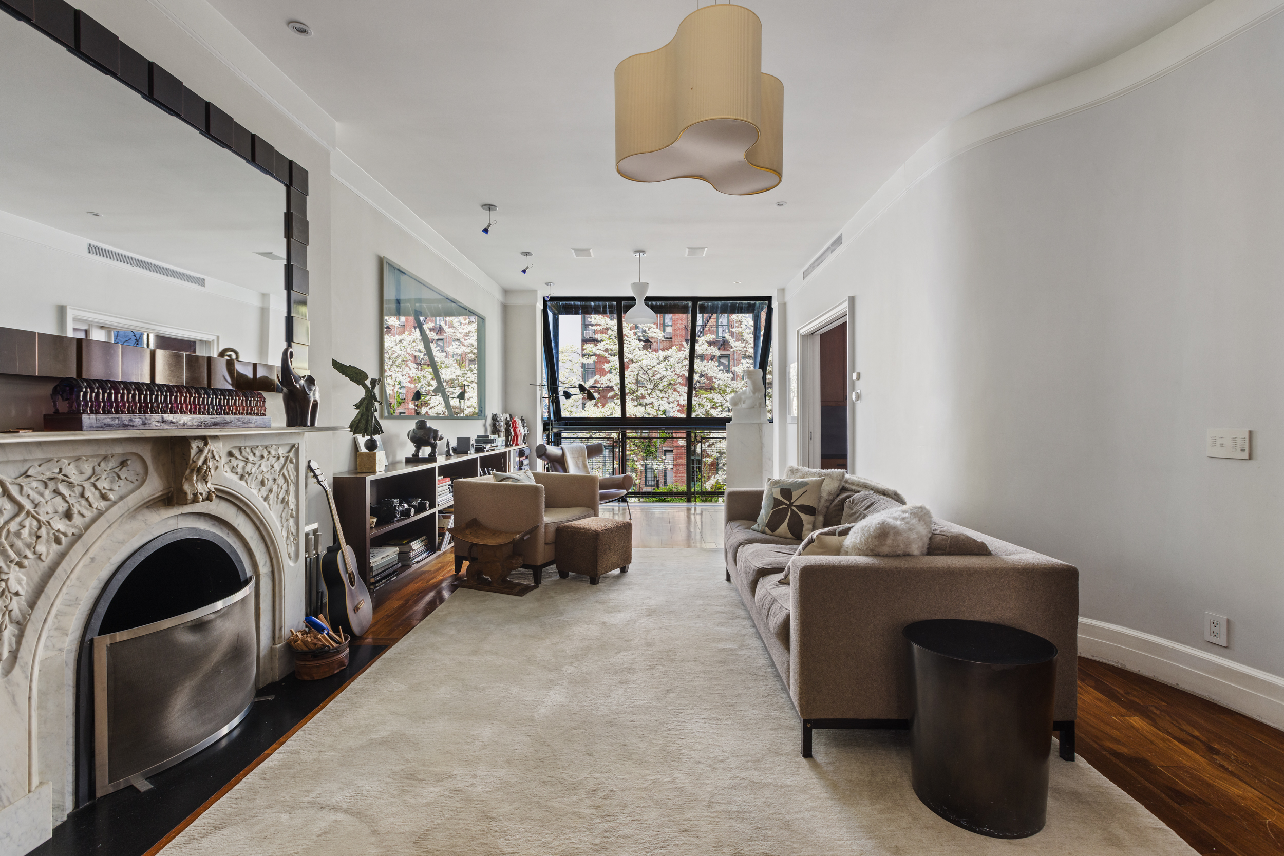 83 Jane Street Manhattan, NY 10014 - Photo 8 of 29 a living room with furniture and a fireplace