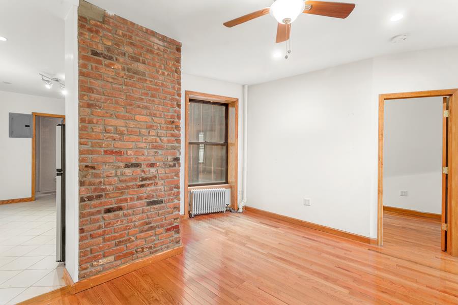 56 MacDougal Street, Unit 16 Manhattan, NY 10012 - Photo 2 of 6 a view of empty room with wooden floor