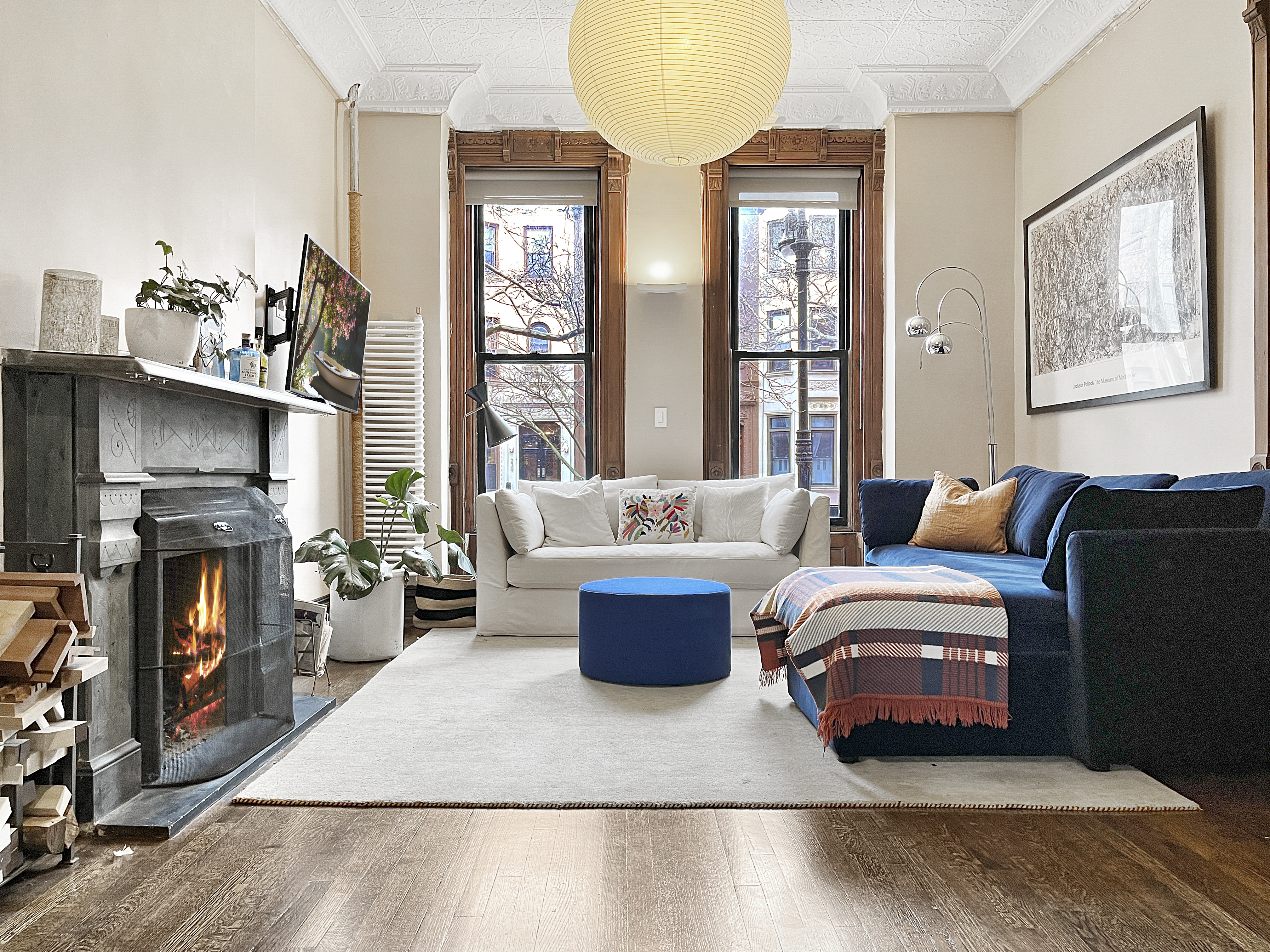 252 Stuyvesant Avenue Brooklyn, NY 11221 - Photo 6 of 26 a living room with furniture large window and fireplace