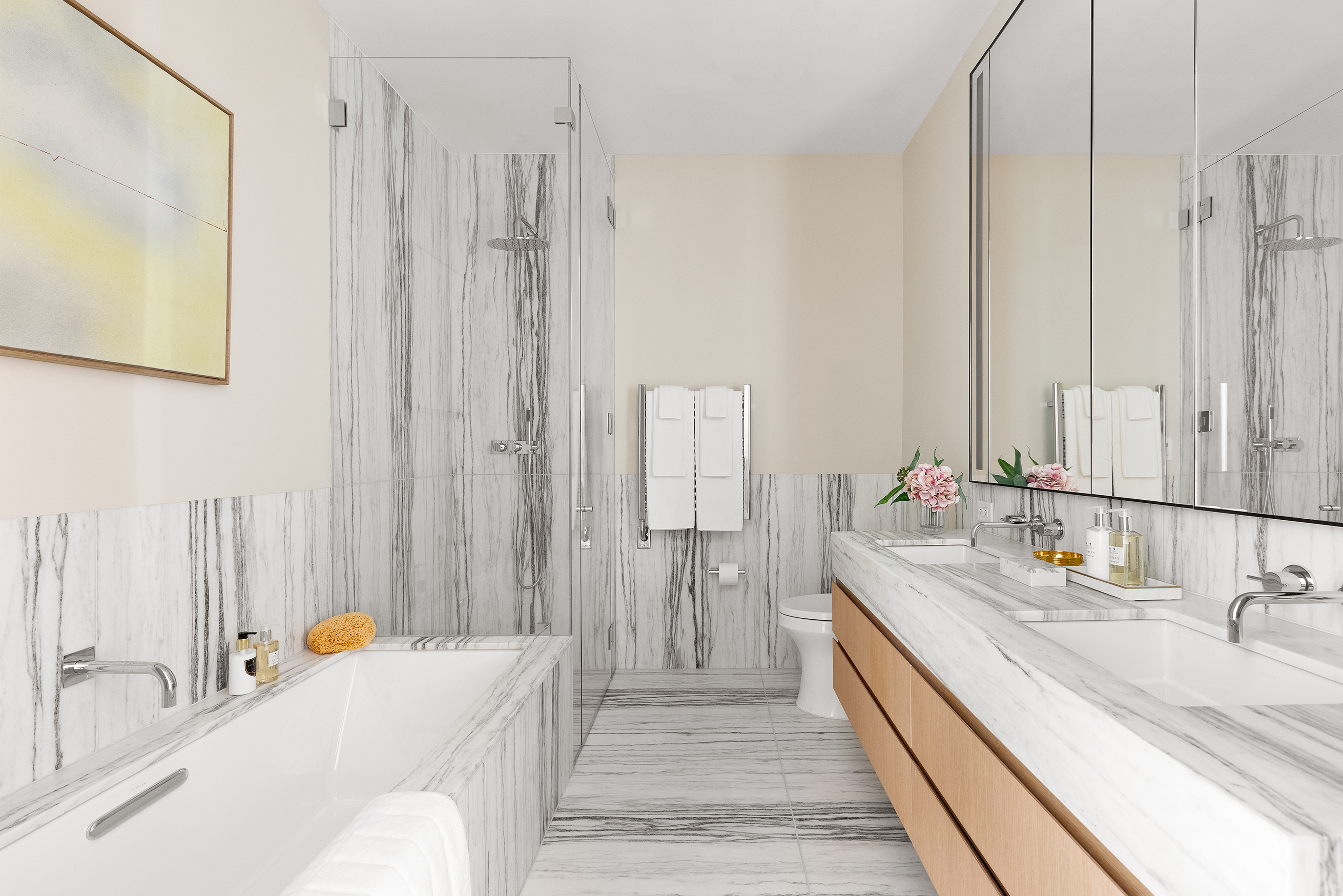 33 Park Row, Unit 16A Manhattan, NY 10038 - Photo 11 of 24 a bathroom with a double vanity sink and a mirror