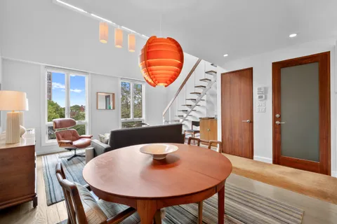 a view of living room with furniture and window