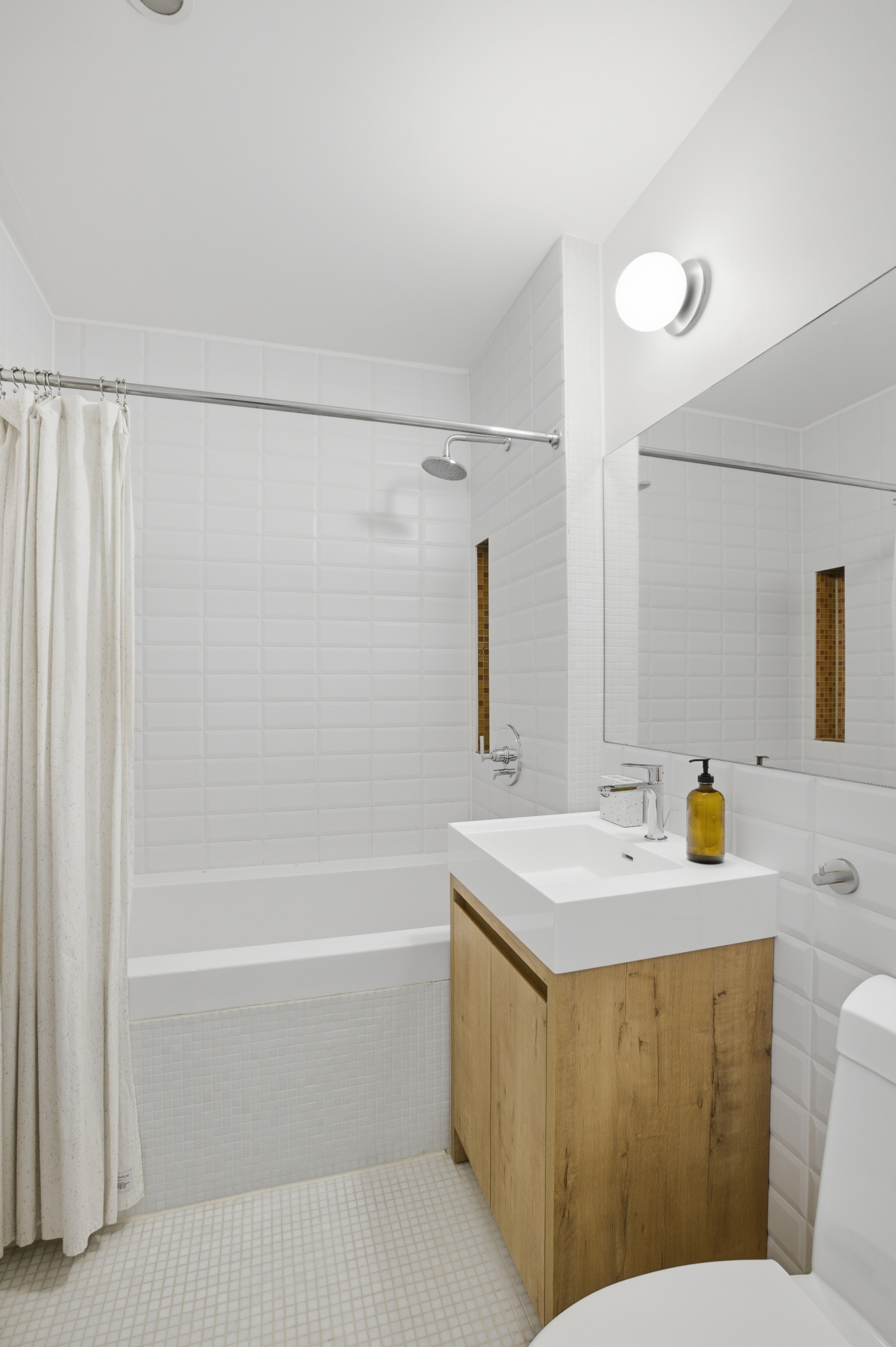 433 Warren Street, Unit 2C Brooklyn, NY 11217 - Photo 15 of 19 a bathroom with a sink a toilet and shower
