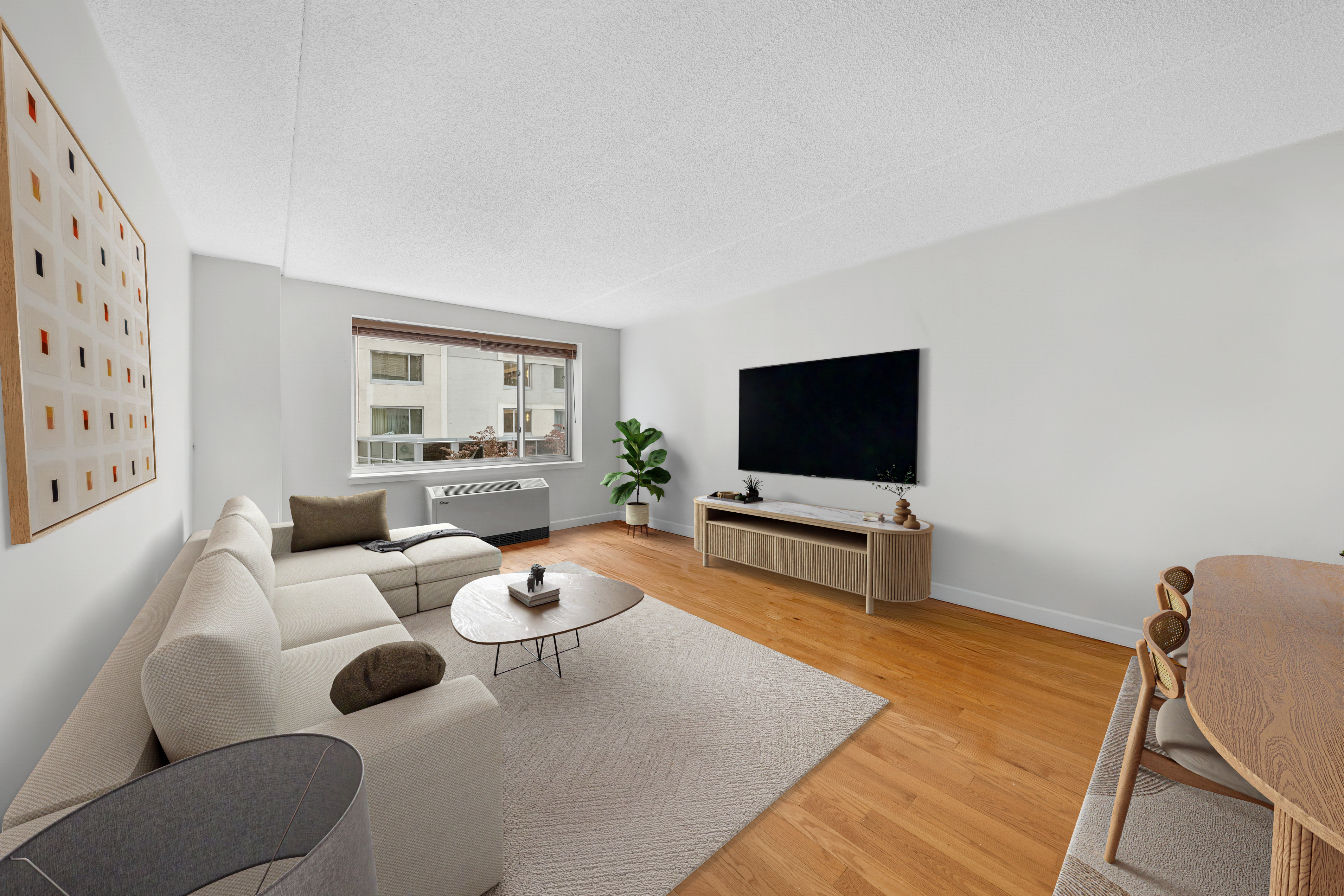 40 West 116th Street, Unit B301 Manhattan, NY 10026 - Photo 3 of 17 a living room with furniture and a flat screen tv
