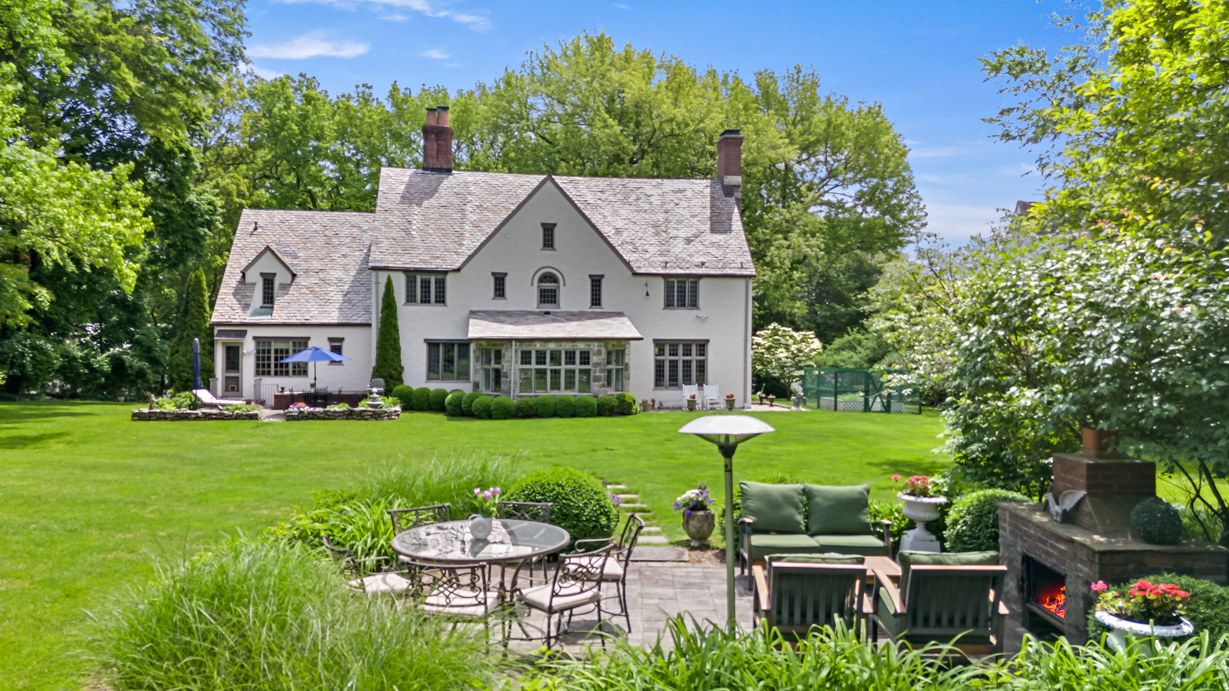 19 Avon Road Larchmont, NY 10538 - Photo 21 of 35 a view of a chair and table on the garden
