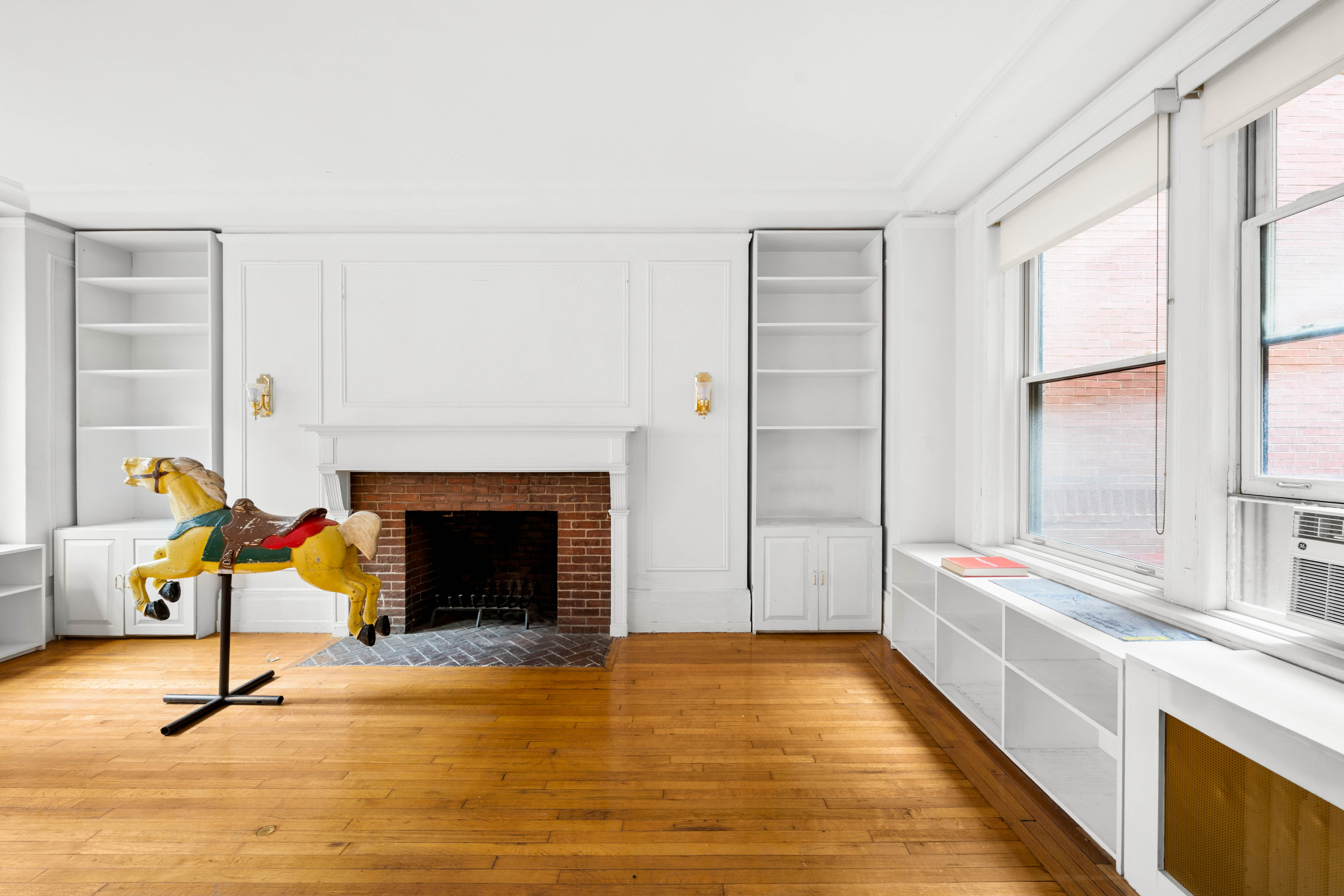 50 West 67th Street, Unit 4E Manhattan, NY 10023 - Photo 2 of 8 a living room with furniture and a fireplace