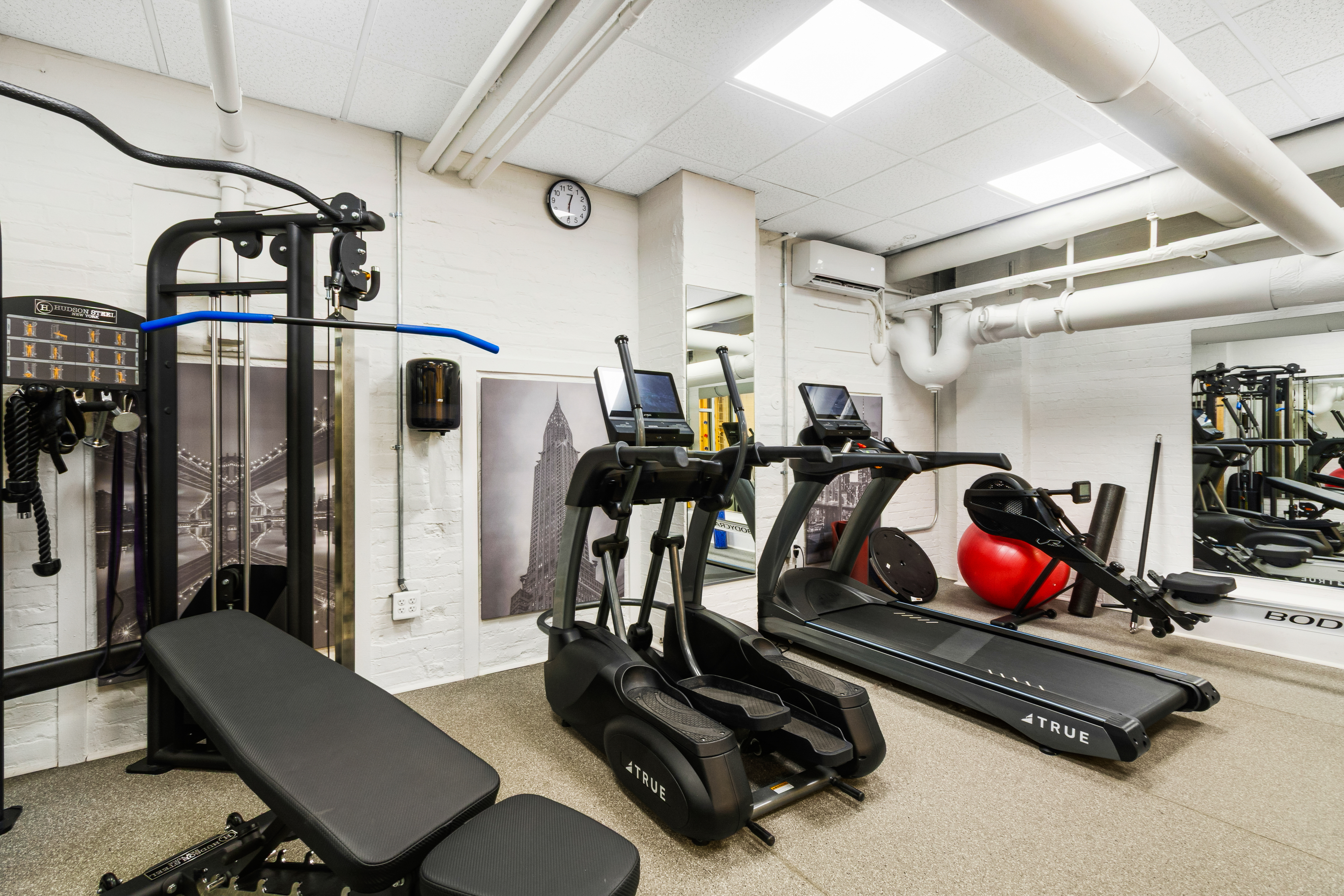 205 West 89th Street, Unit 6RS Manhattan, NY 10024 - Photo 16 of 19 a room with gym equipment and wooden floor