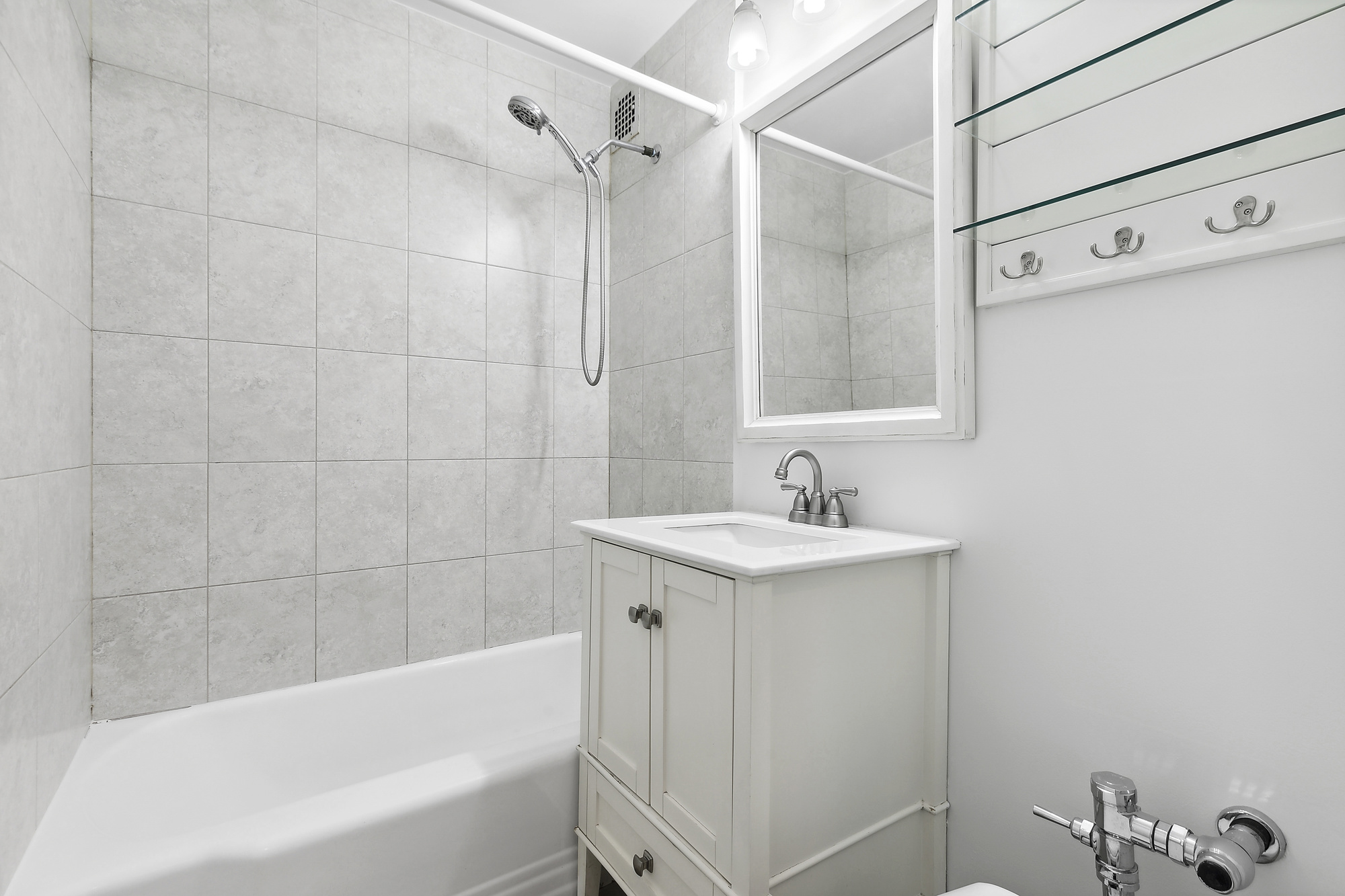 157 East 18th Street, Unit 4H Manhattan, NY 10003 - Photo 5 of 7 a bathroom with a sink and a bathtub