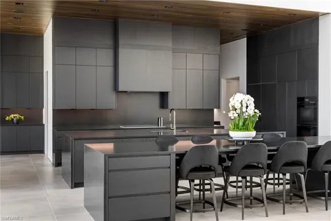 a kitchen with a table chairs and a stove