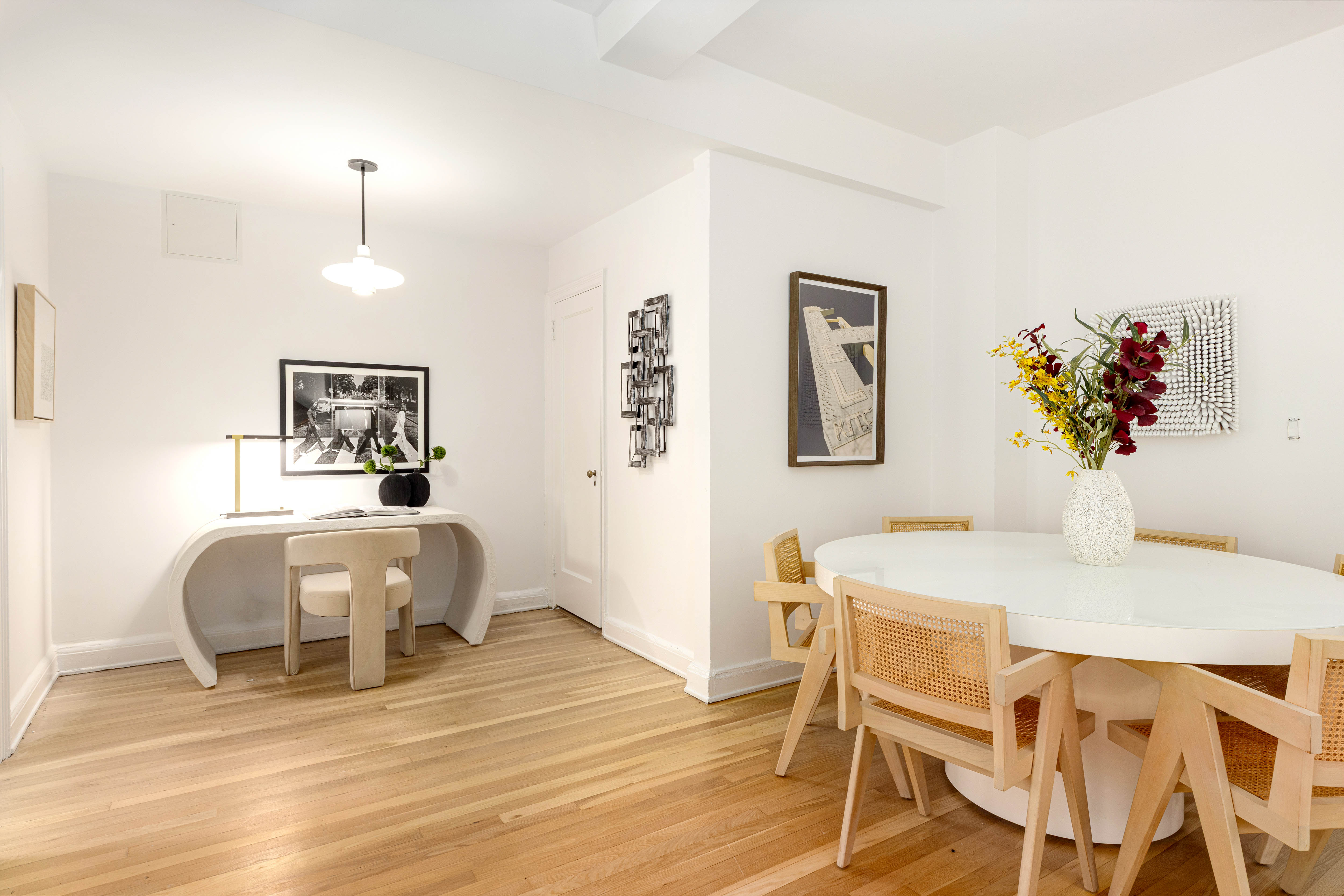 400 East 52nd Street, Unit 10K Manhattan, NY 10022 - Photo 3 of 6 a bedroom with a bed and a table chair