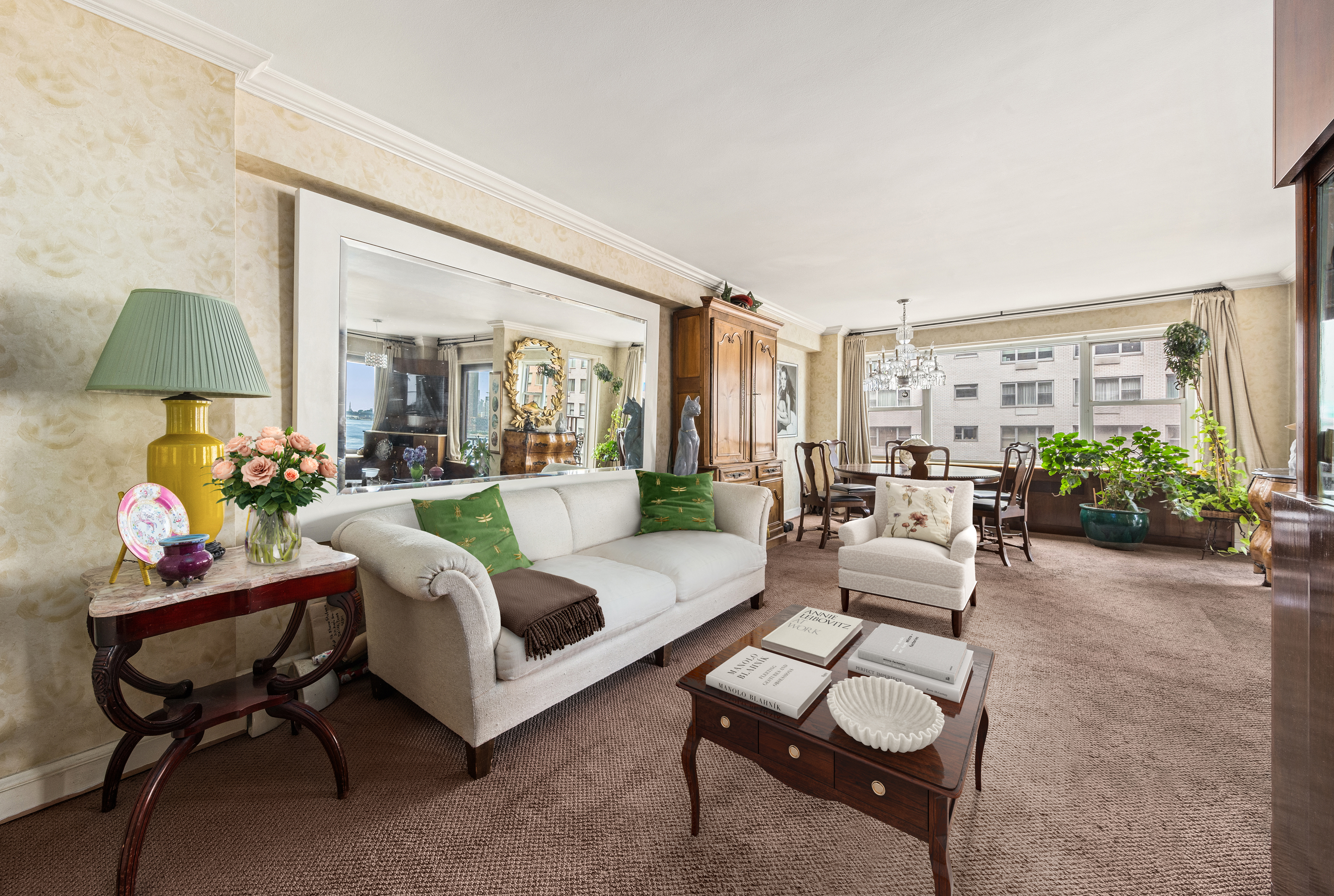 50 Sutton Place South, Unit 9F Manhattan, NY 10022 - Photo 2 of 10 a living room with furniture and a potted plant