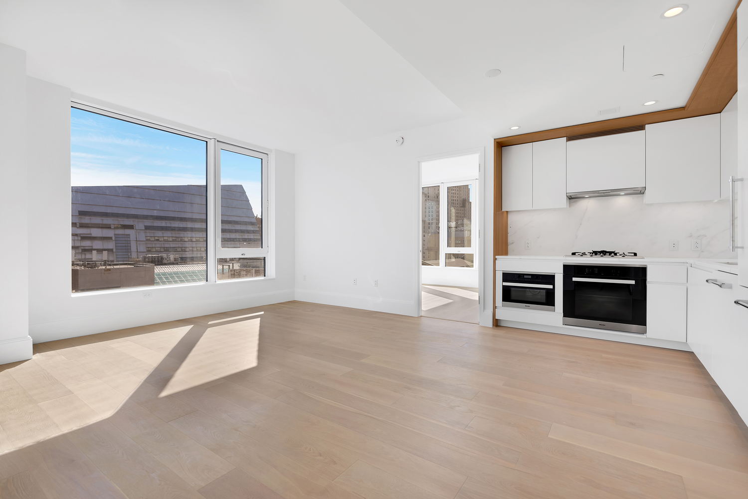 368 3rd Avenue, Unit 15C Manhattan, NY 10016 - Photo 3 of 17 a view of kitchen with furniture and window