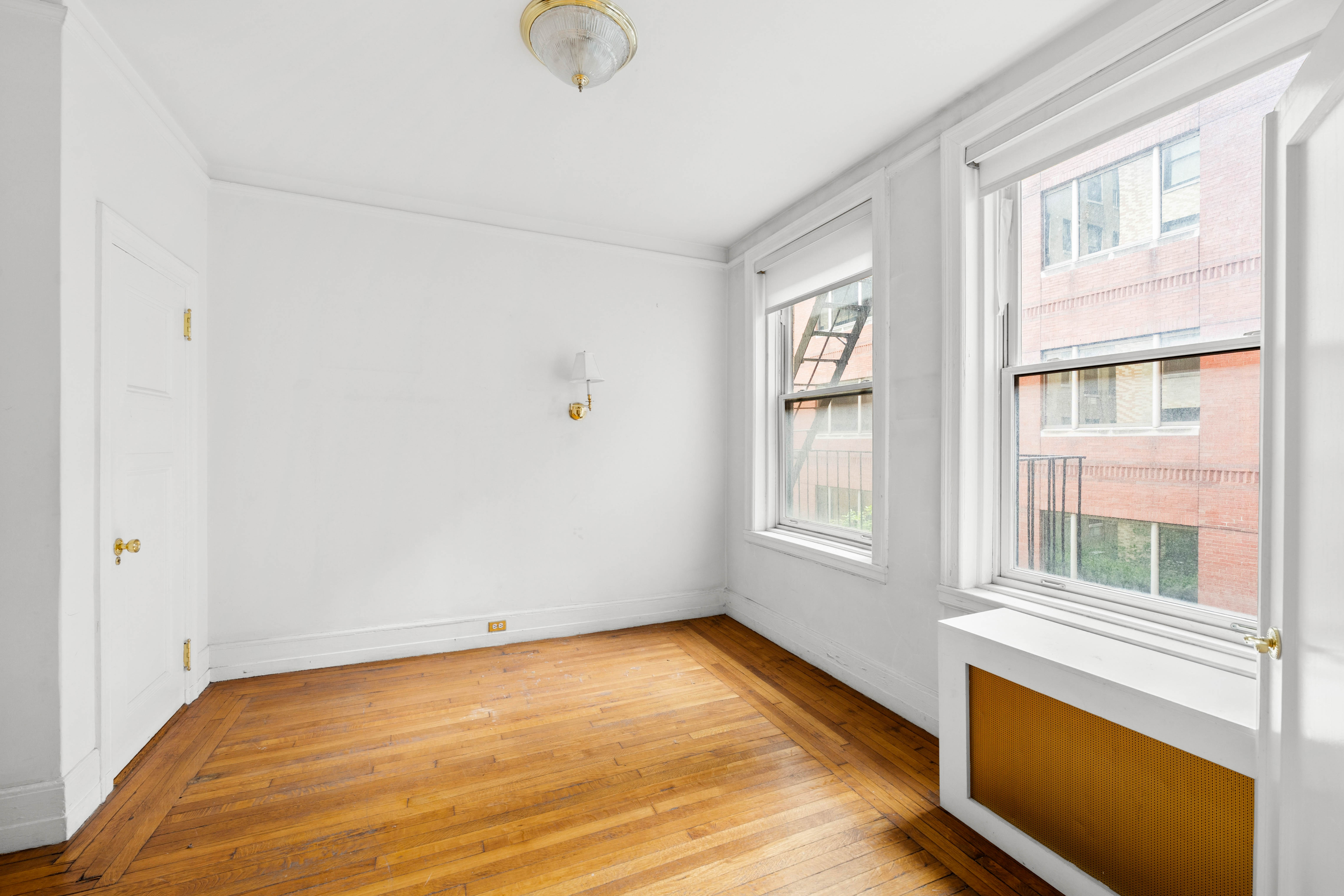 50 West 67th Street, Unit 4E Manhattan, NY 10023 - Photo 4 of 8 a view of an empty room with a window