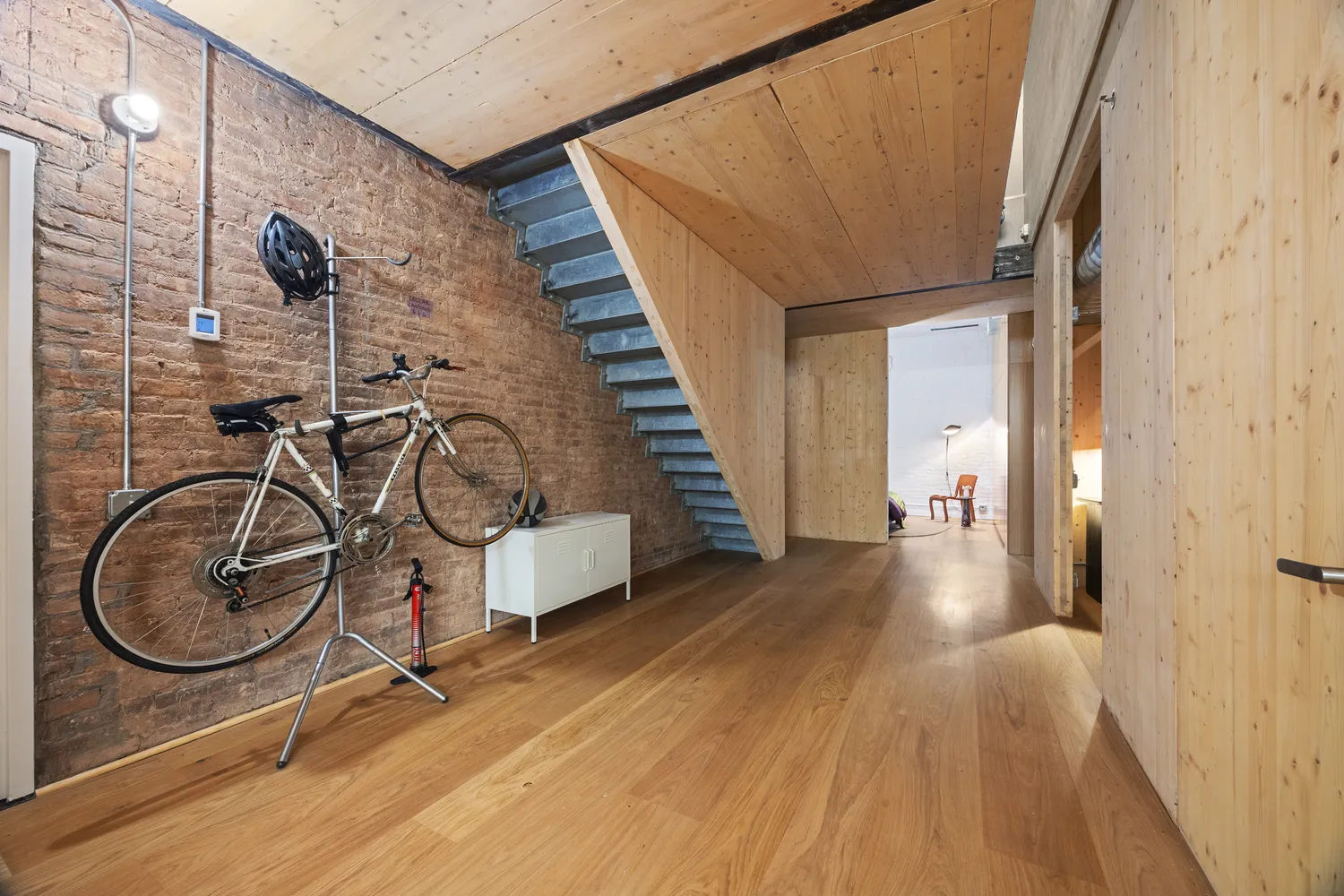 a room with furniture and a wooden floor