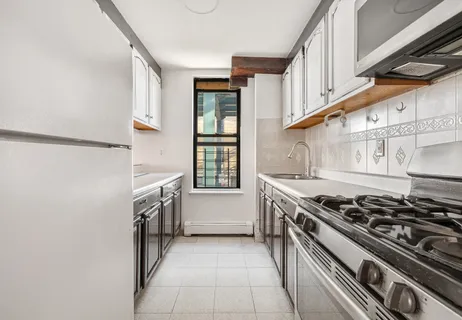 a kitchen with a stove and a sink