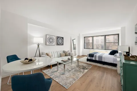 a living room with furniture and a table