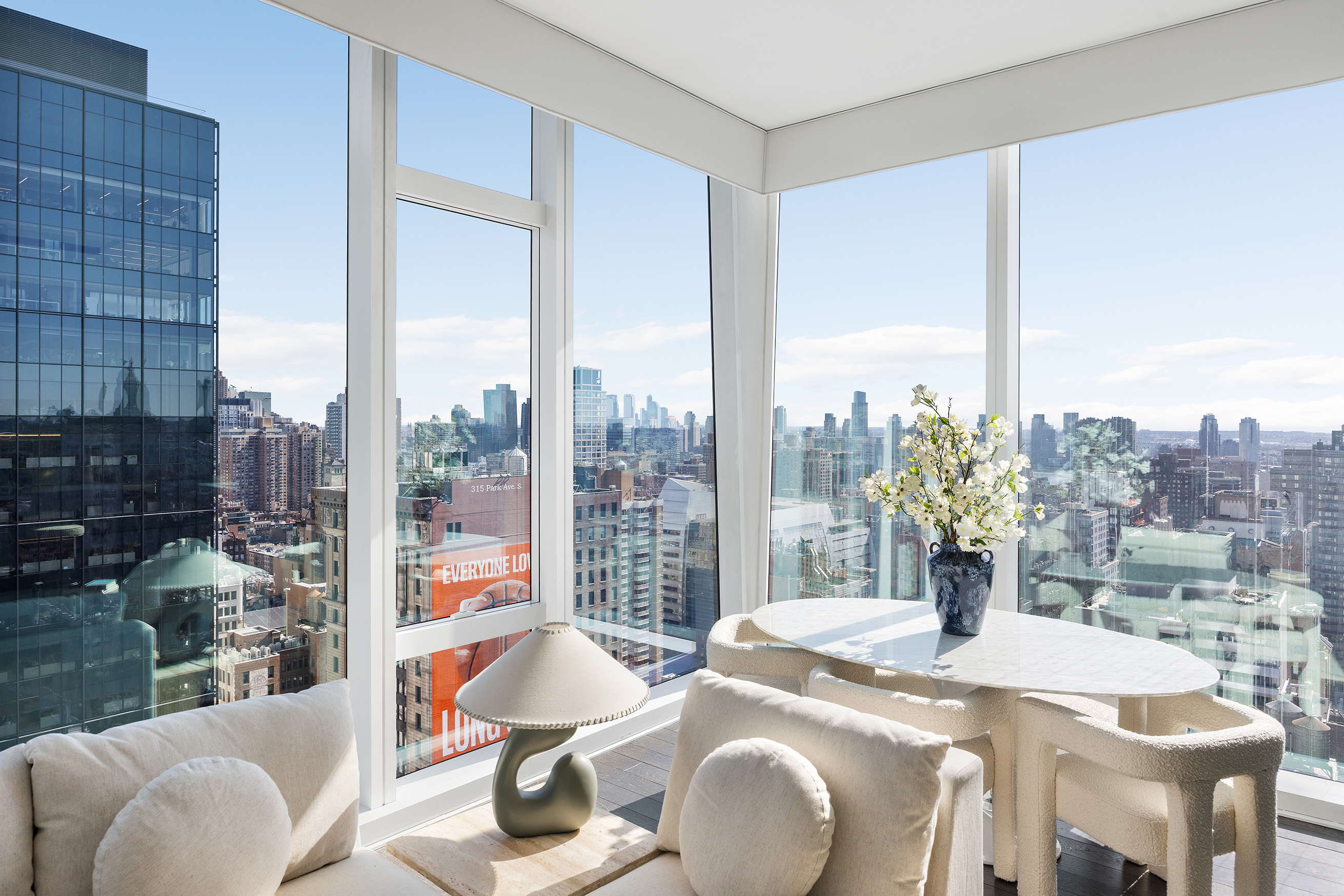 45 East 22nd Street, Unit 32B Manhattan, NY 10010 - Photo 18 of 36 a view of a dining room with furniture window and outside view