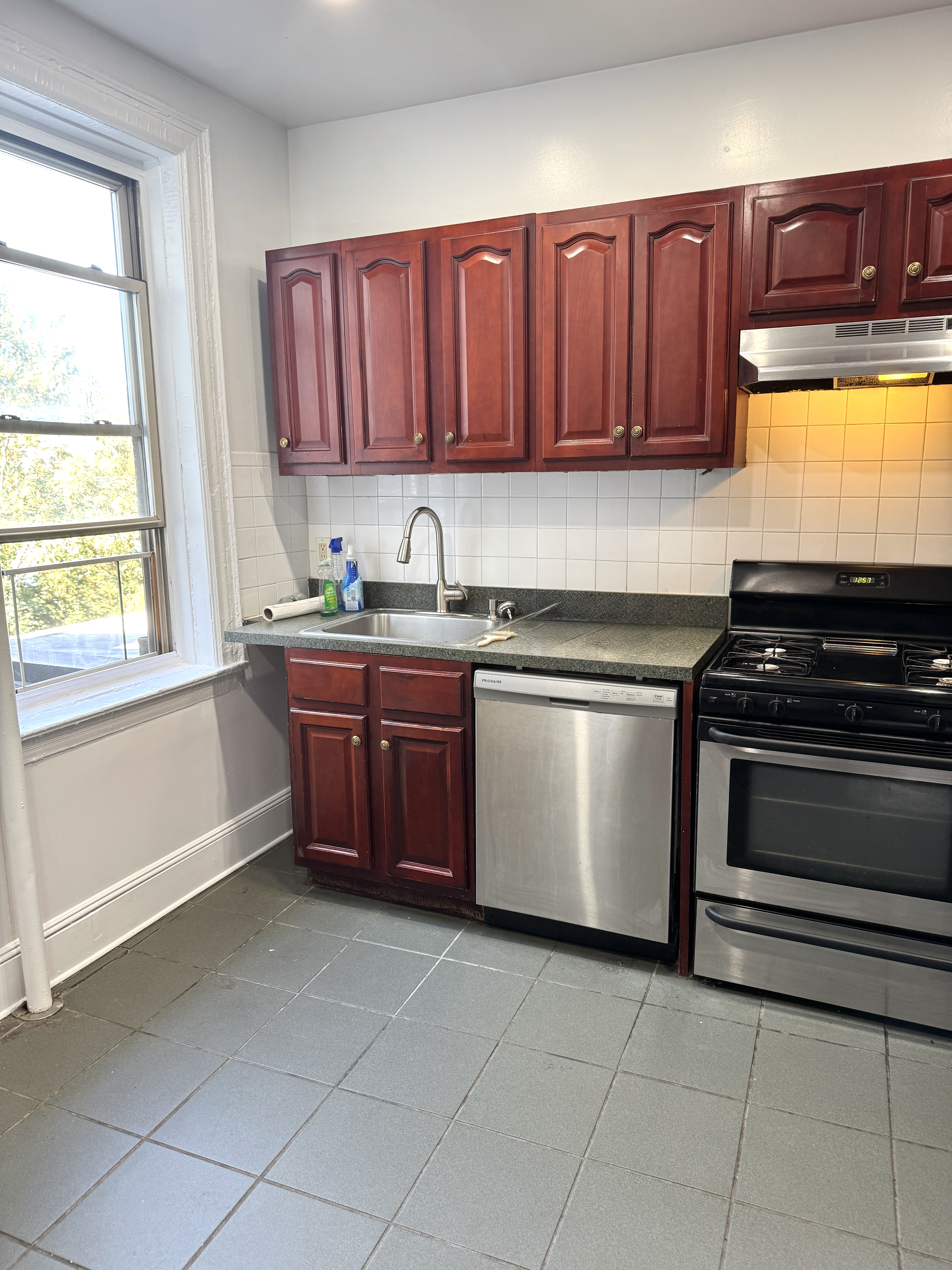 260 Cumberland Street, Unit 21 Brooklyn, NY 11205 - Photo 3 of 13 a kitchen with appliances cabinets and a window