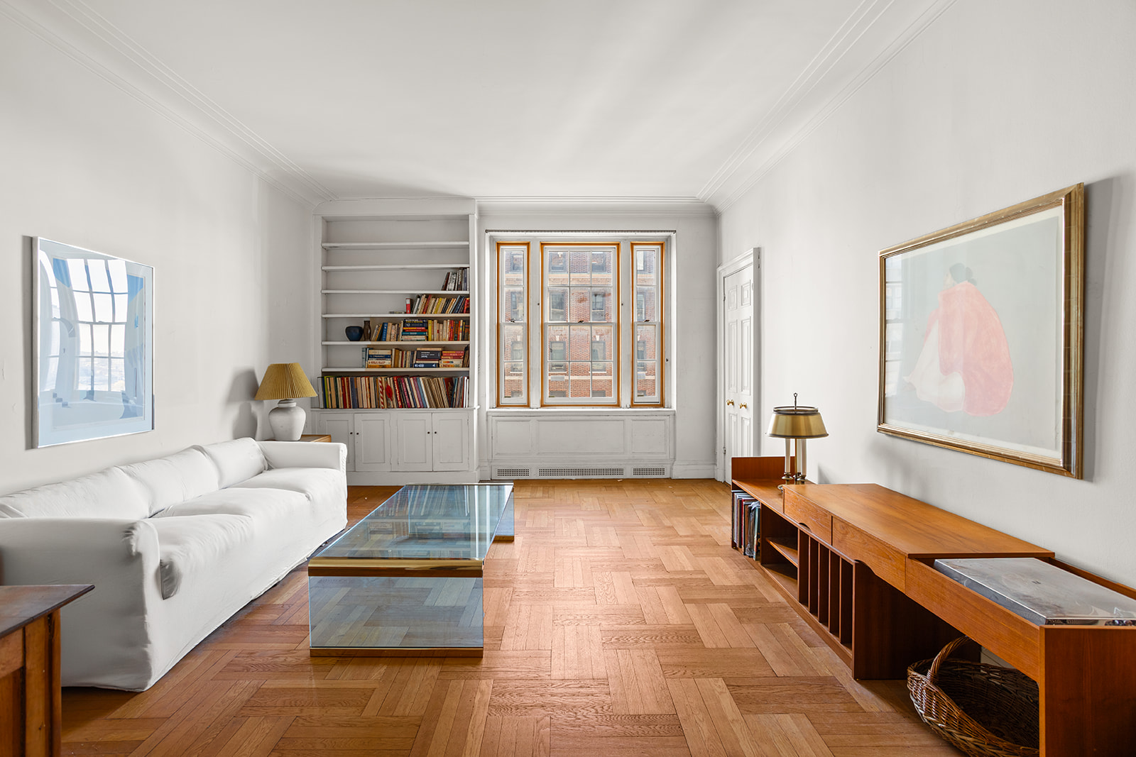 30 Sutton Place, Unit 12E Manhattan, NY 10022 - Photo 1 of 8 a living room with furniture and large windows