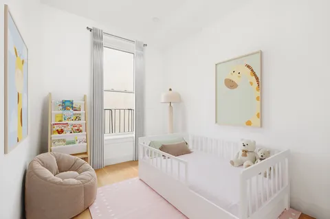 a bedroom with furniture and a rug