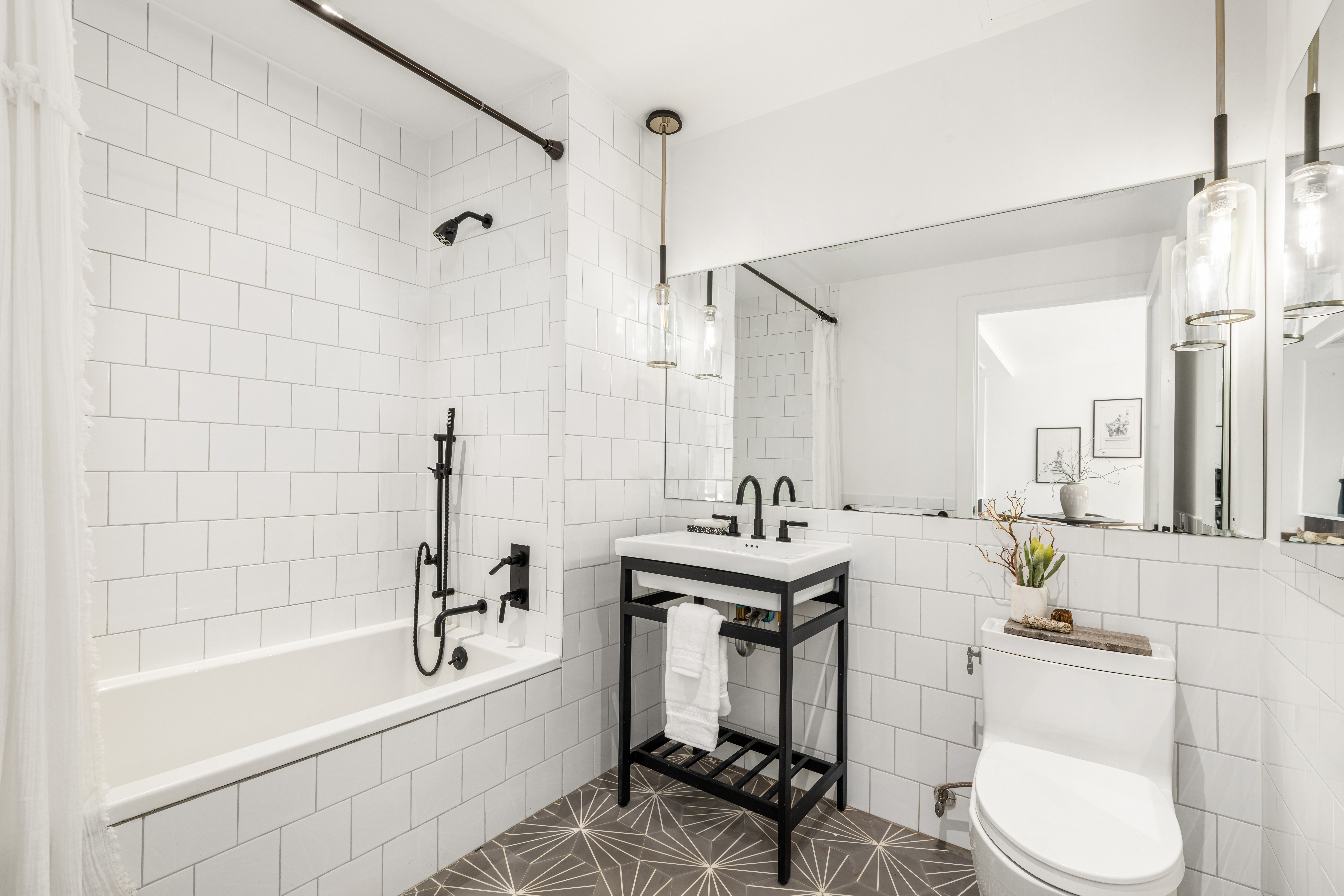 529 Park Place, Unit 401 Brooklyn, NY 11238 - Photo 7 of 13 a bathroom with a sink toilet a mirror and shower