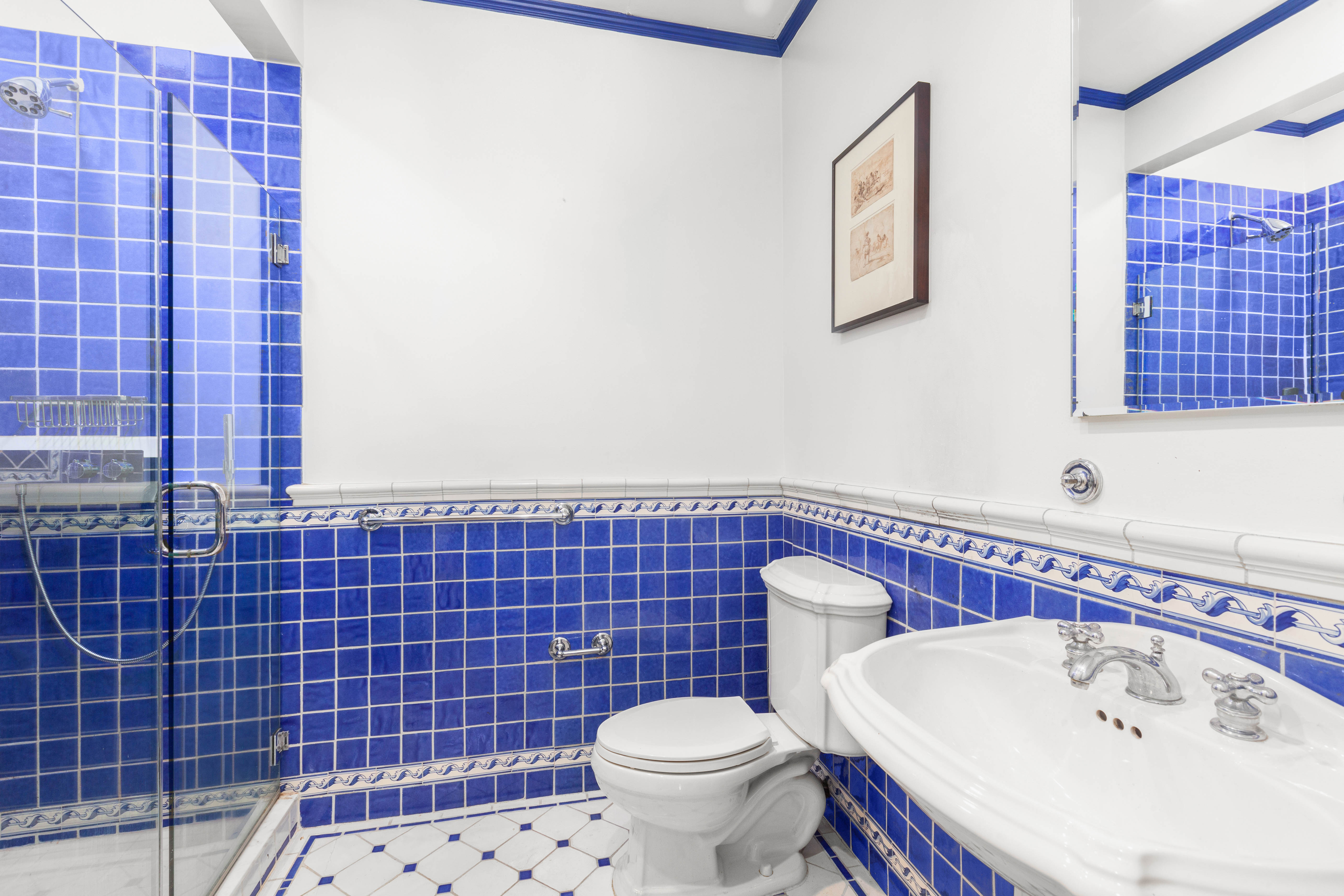30 East 21st Street, Unit 6B Manhattan, NY 10010 - Photo 13 of 16 a bathroom with a sink toilet and shower
