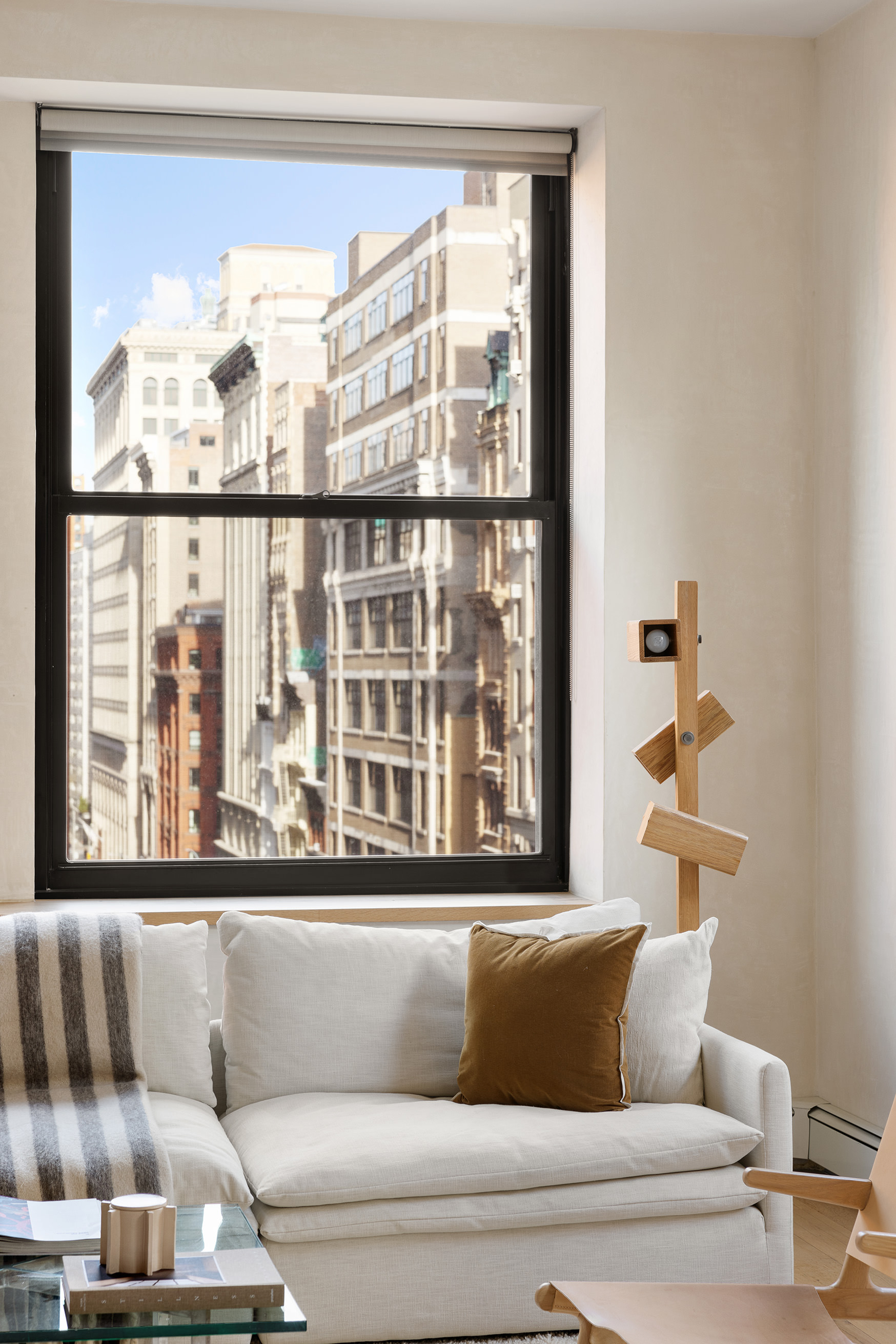 250 Mercer Street, Unit B706B707 Manhattan, NY 10012 - Photo 22 of 25 a living room with furniture and a window