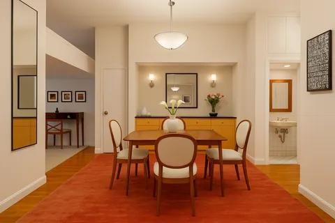 a dining room with furniture and wooden floor