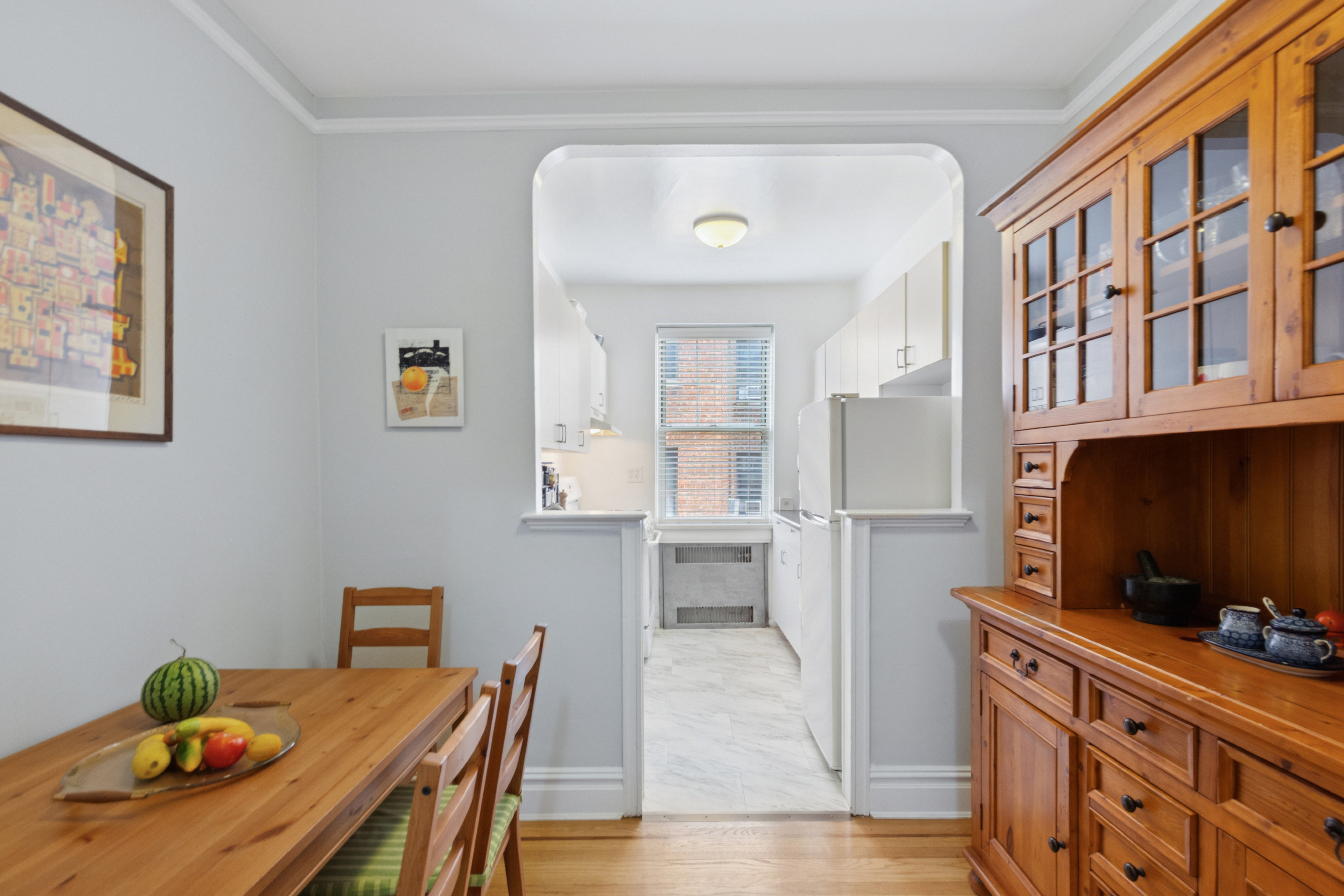 720 Fort Washington Avenue, Unit 5D Manhattan, NY 10040 - Photo 4 of 17 a kitchen with stainless steel appliances kitchen island granite countertop a refrigerator and a stove top oven