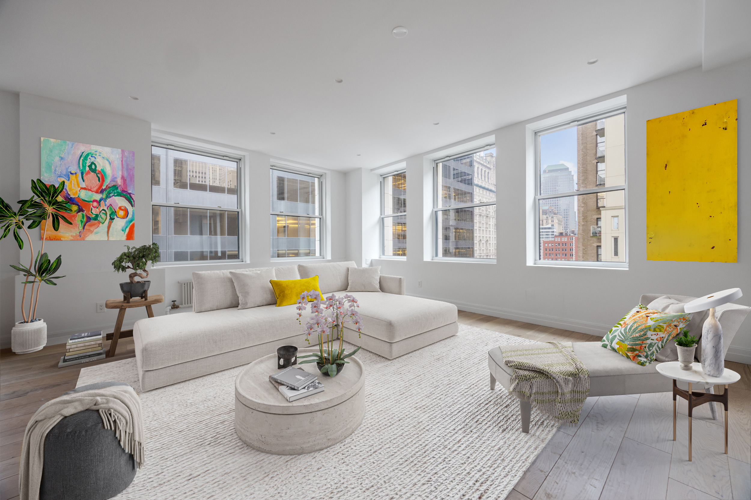 a living room with furniture and a potted plant