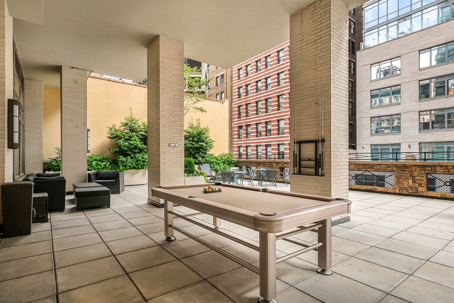 35 West 33rd Street, Unit 26A Manhattan, NY 10001 - Photo 12 of 28 a living room with furniture and large windows