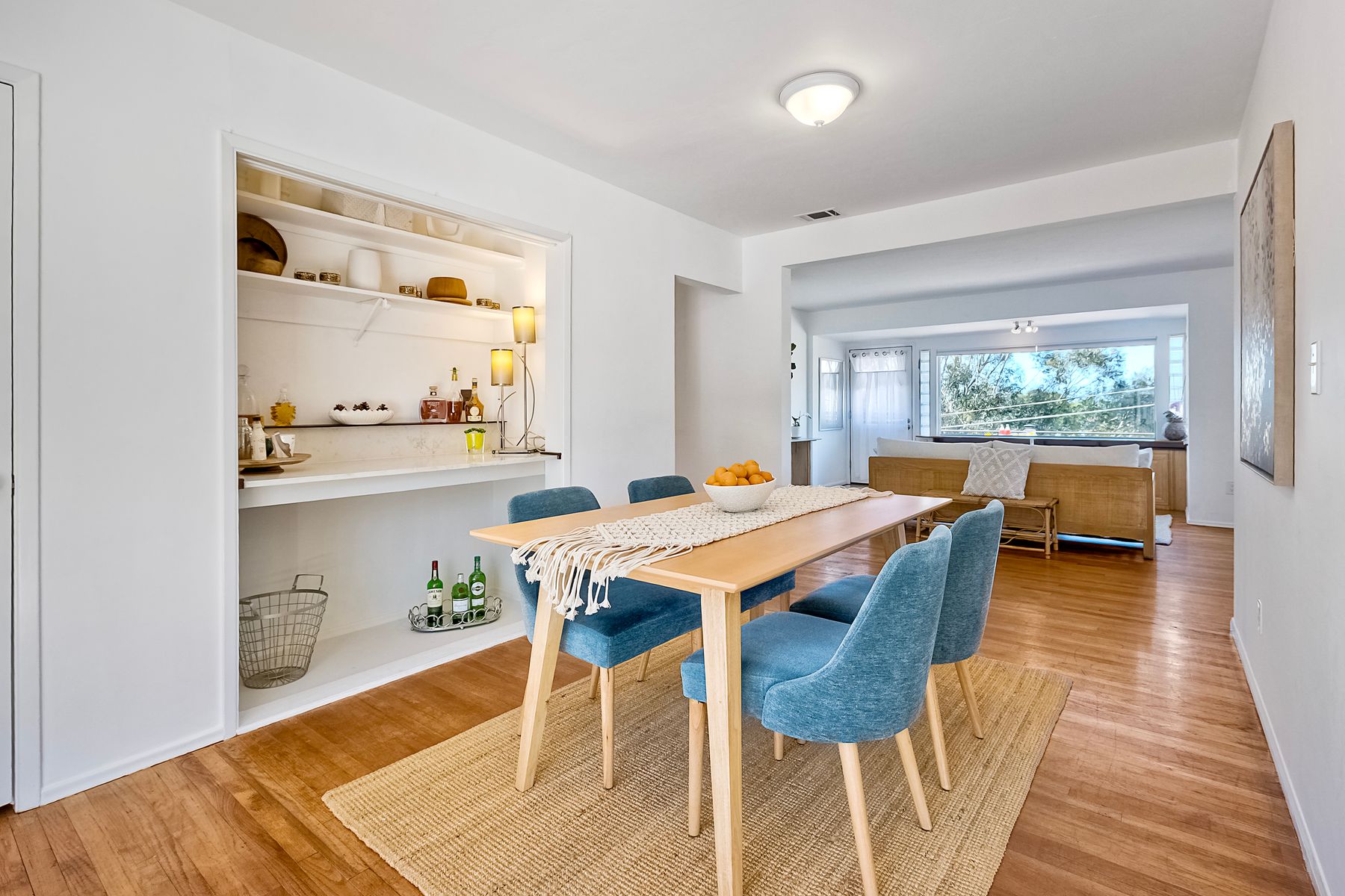 534 Hoover Street Oceanside, CA 92054 - Photo 16 of 31 a dining room with a table chairs and a kitchen view