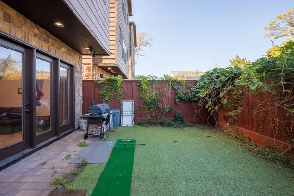 a backyard of a house with lots of green space