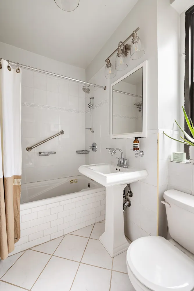 a bathroom with a sink a toilet and a bathtub