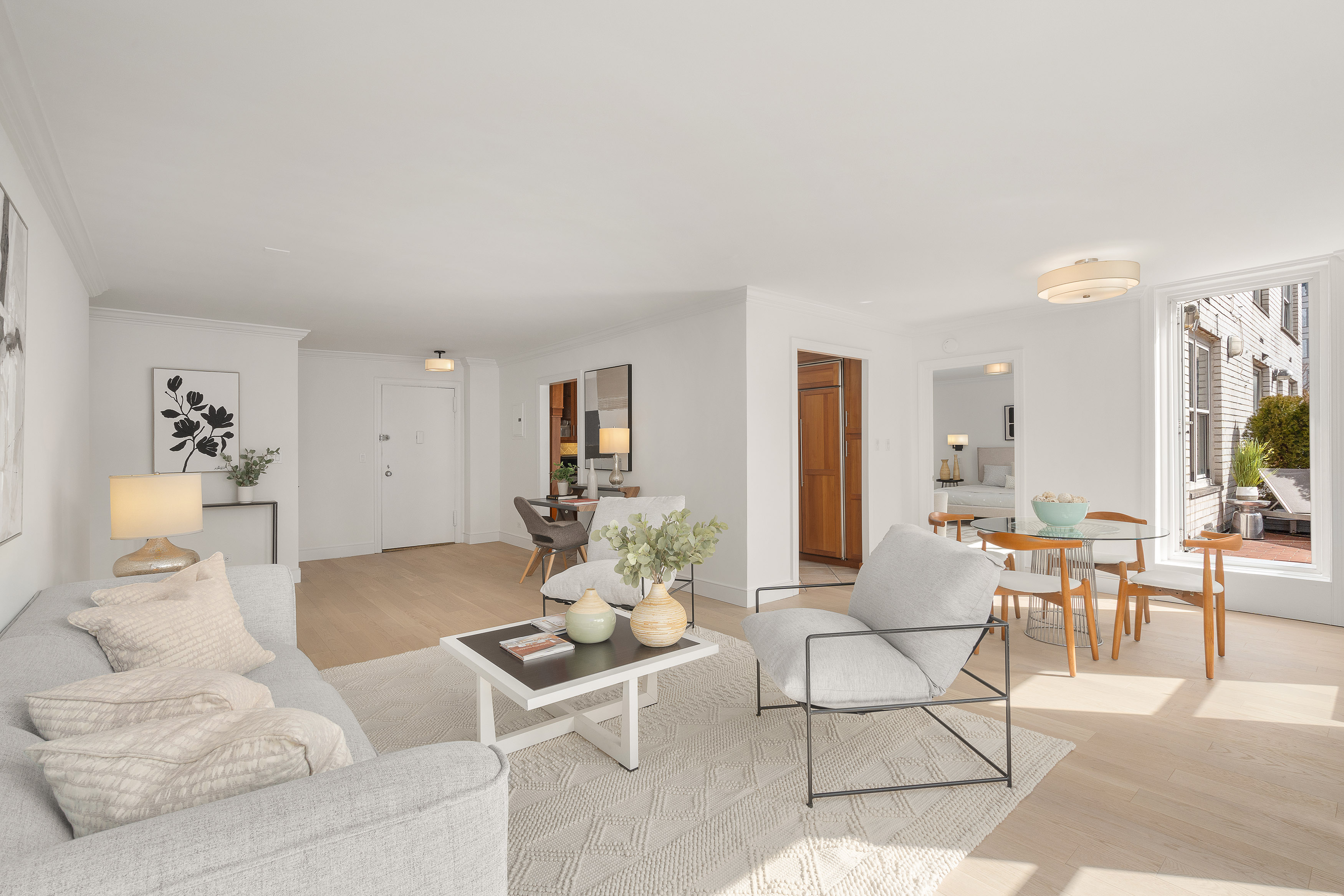 207 East 74th Street, Unit 11E Manhattan, NY 10021 - Photo 2 of 20 a living room with furniture and wooden floor