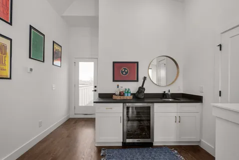 a kitchen with a sink stove and cabinets
