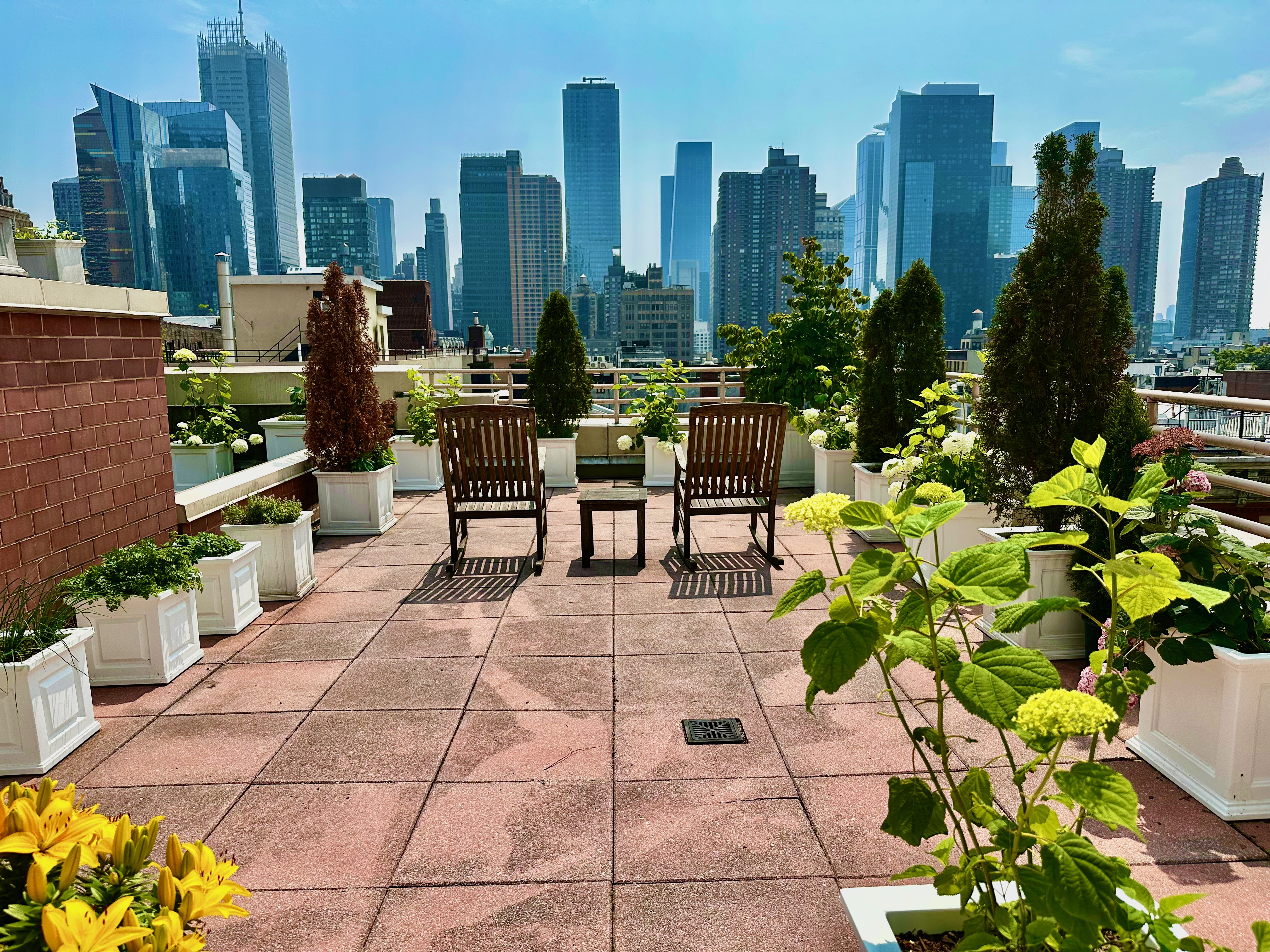 393 West 49th Street, Unit 5C Manhattan, NY 10019 - Photo 17 of 21 a view of a patio with plants and chairs
