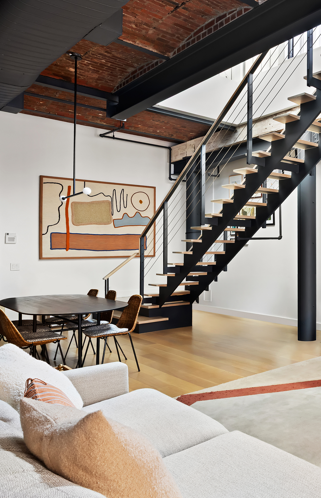 63 Greene Street, Unit PHB Manhattan, NY 10012 - Photo 3 of 17 a living room with lots of furniture and air hockey table