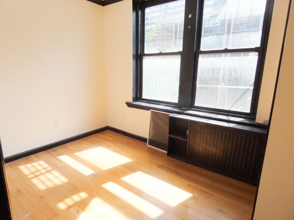 1773 1st Avenue, Unit 9 Manhattan, NY 10128 - Photo 5 of 5 a view of an empty room with a window