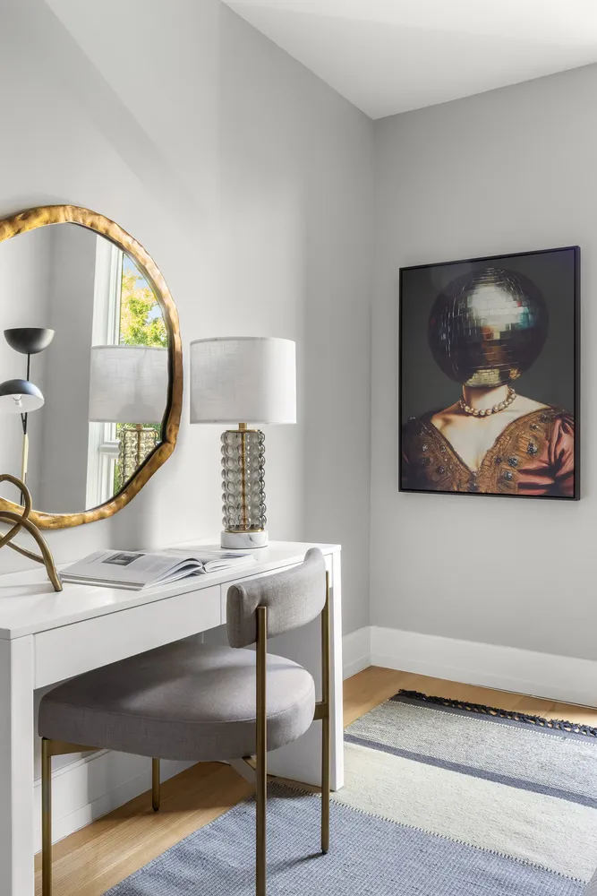 a view of a hallway with paintings on the wall