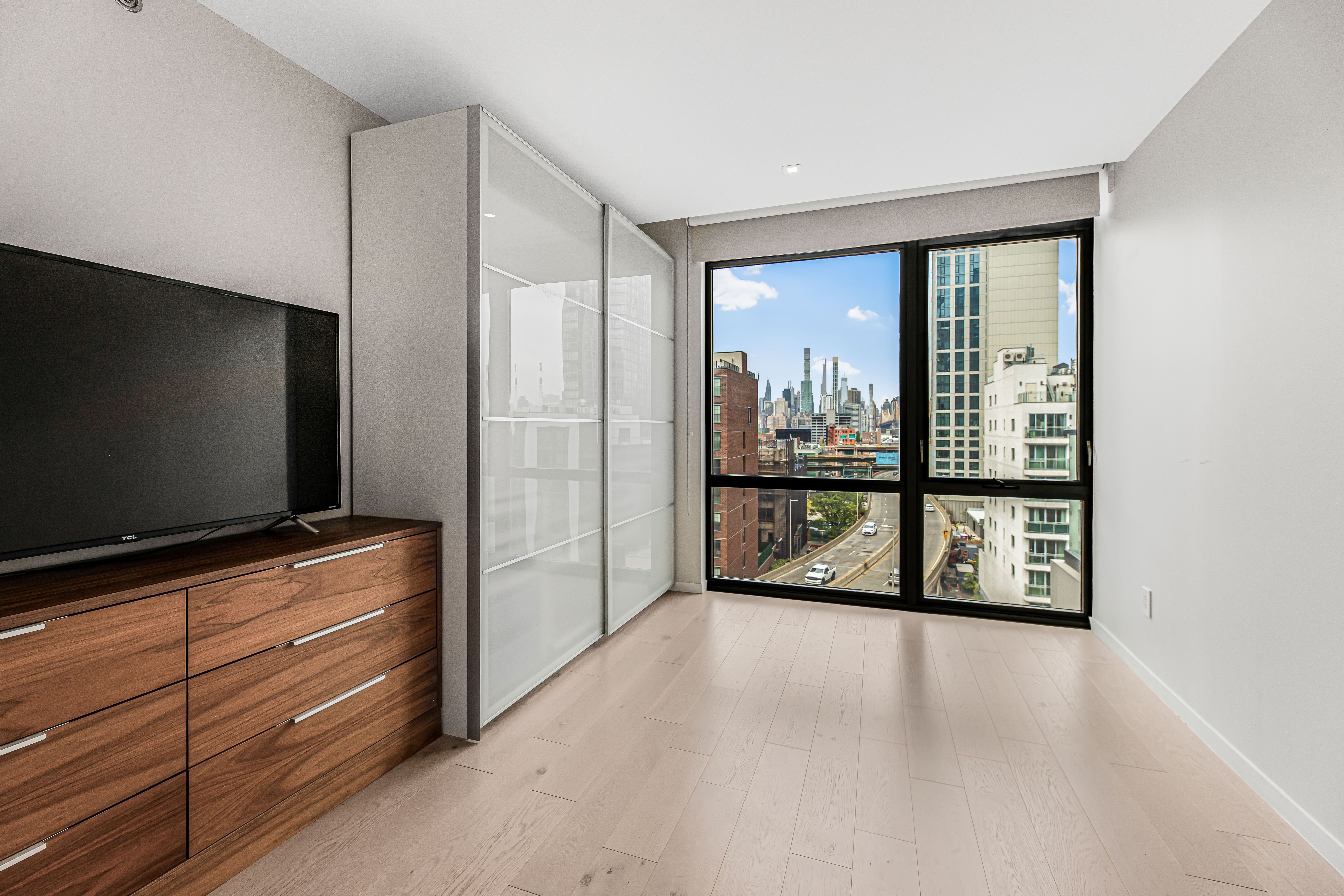 42-50 27th Street, Unit 9C Queens, NY 11101 - Photo 9 of 32 a view of a livingroom with furniture