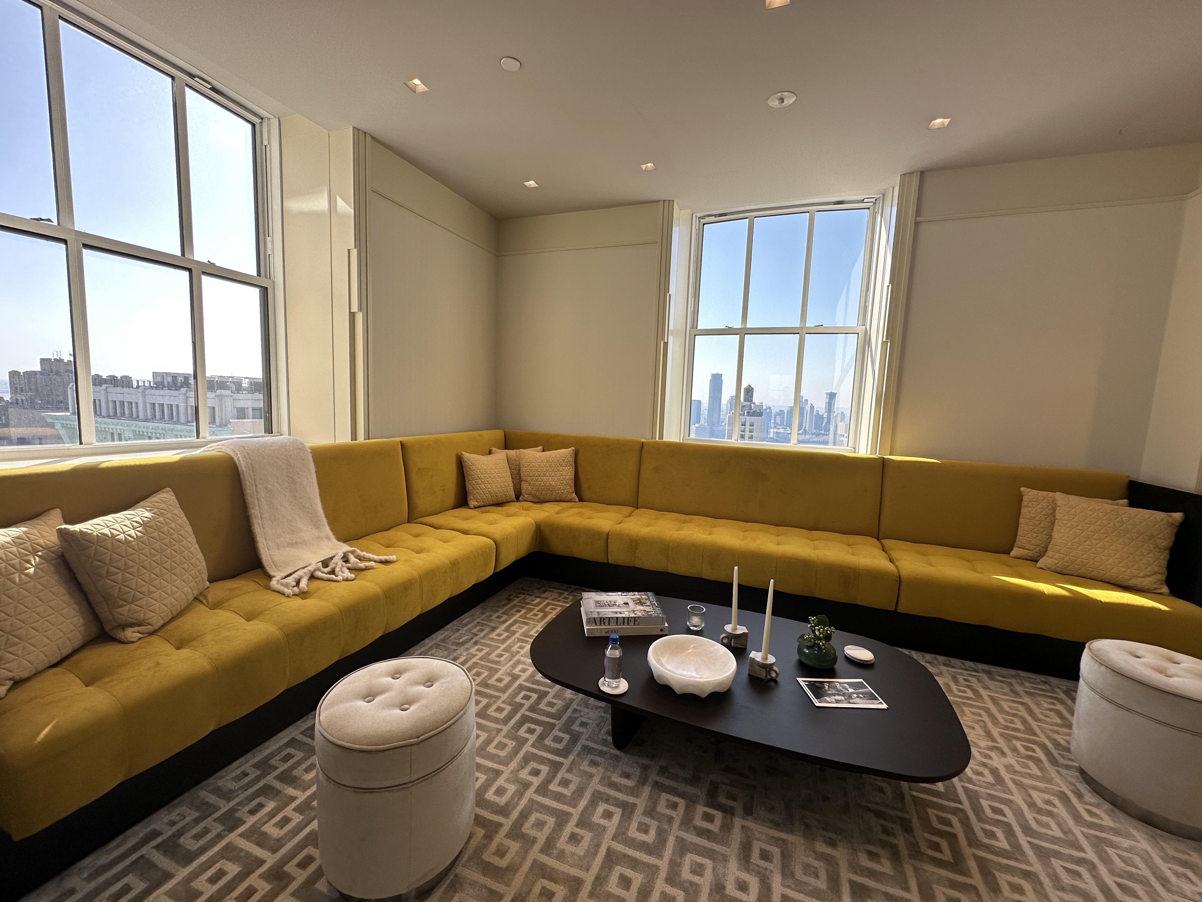 1 Wall Street, Unit 915 Manhattan, NY 10005 - Photo 16 of 18 a living room with furniture and a window