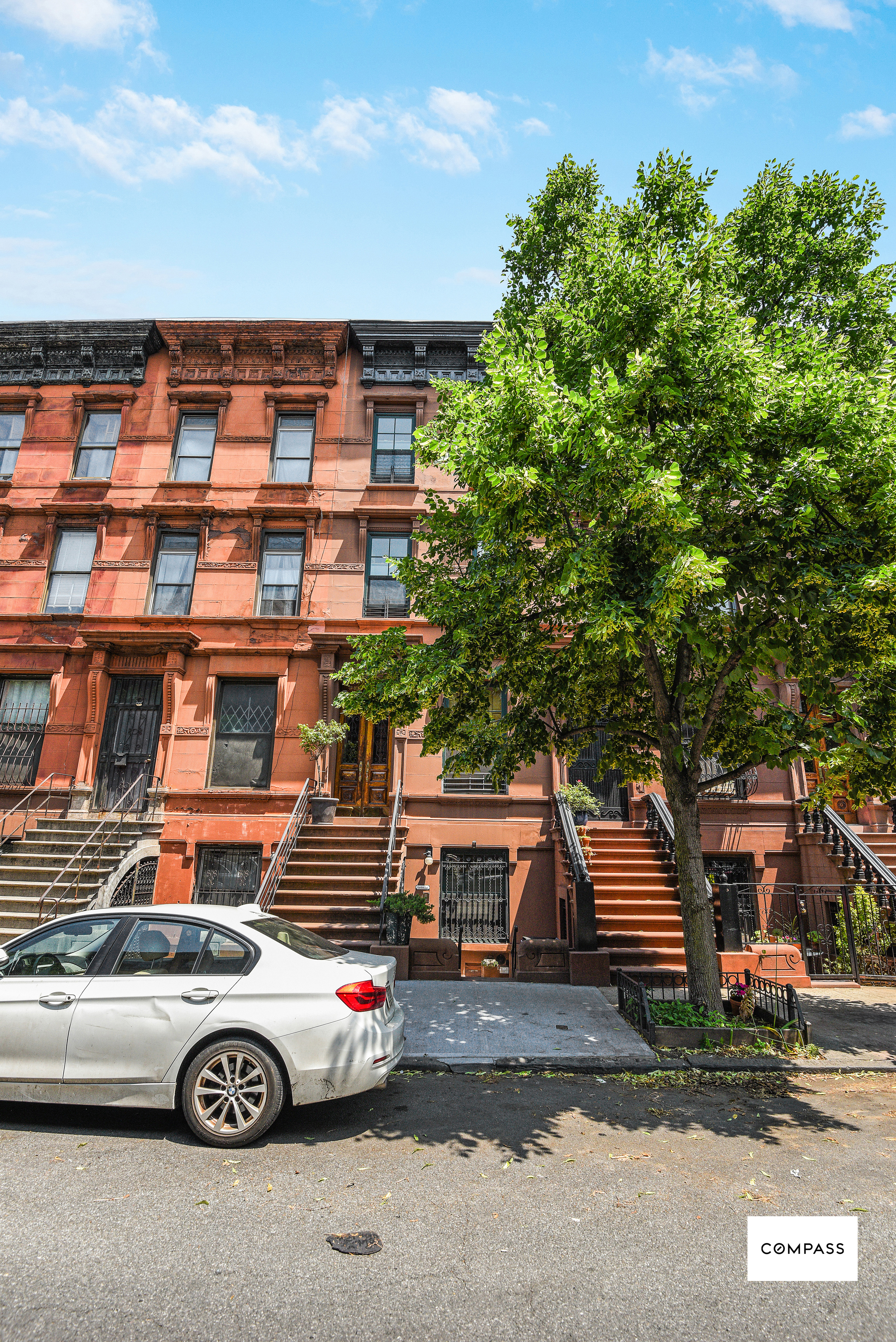 347 West 121st Street Manhattan, NY 10027 - Photo 9 of 10 a front view of a house with parking space