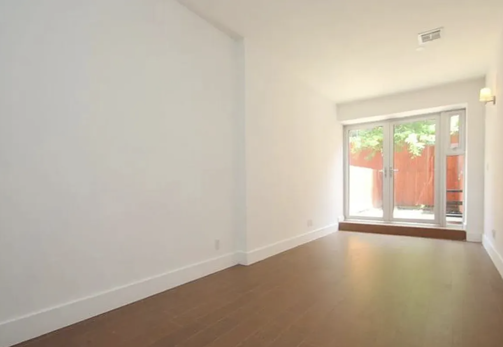 105 Grand Avenue, Unit 1F Brooklyn, NY 11205 - Photo 4 of 7 an empty room with a window