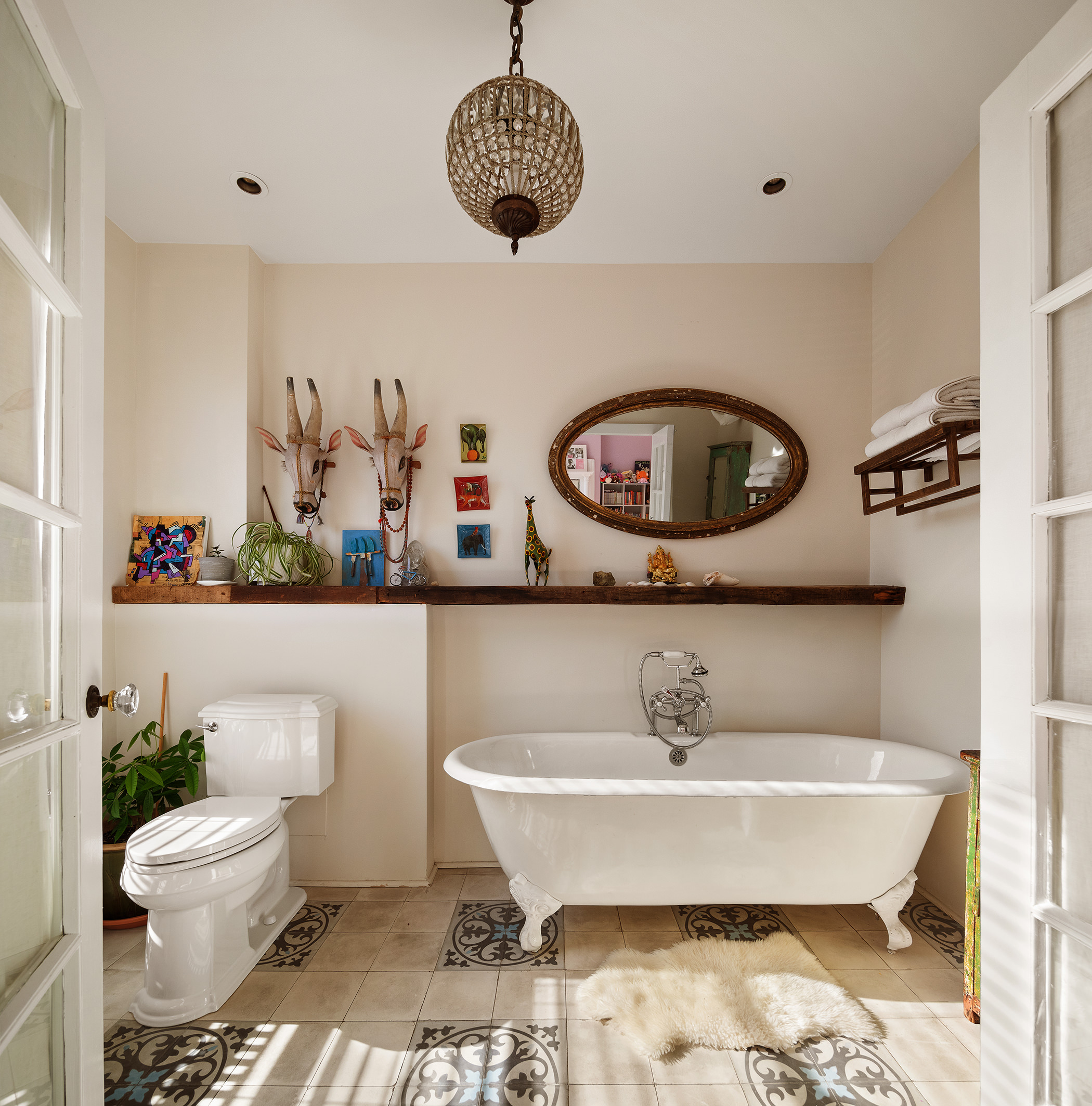 264 Clinton Avenue Brooklyn, NY 11205 - Photo 12 of 21 a bathroom with a toilet a sink and a mirror